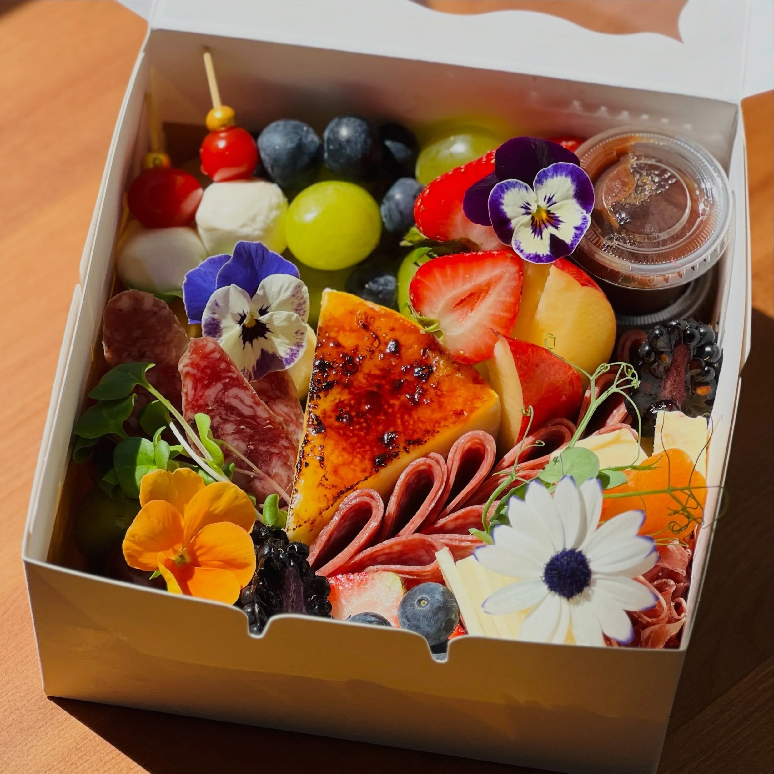 ✨ Small box. Big happiness.

Treat yourself, or someone you&rsquo;re thinking of. Because charcuterie, cheese, and flowers have a way of improving any day. 

#briarhillgourmet #charcuterielove #grazebox #treatyourself #gourmetfood