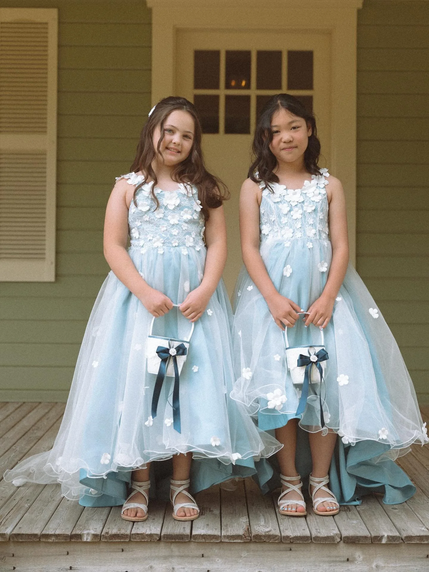 When your flower girls look straight out of a fairytale 💙 These two absolutely stole the show with their sweet smiles and twirl-worthy dresses. Moments like this are what make weddings feel truly magical. ✨📸