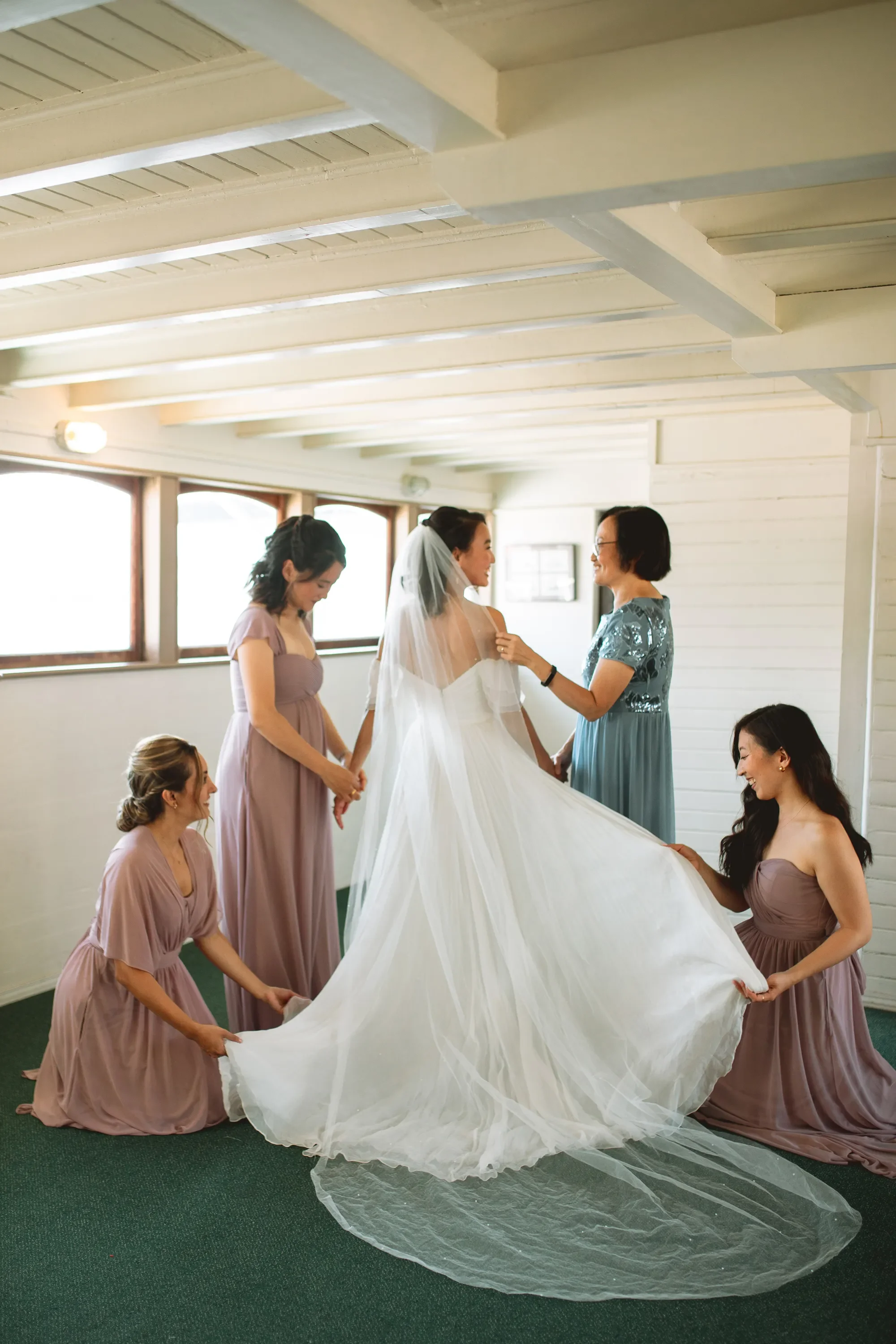 bridesmaids-helping-bride-mv-scansonia-sesttle-wedding-venue.webp