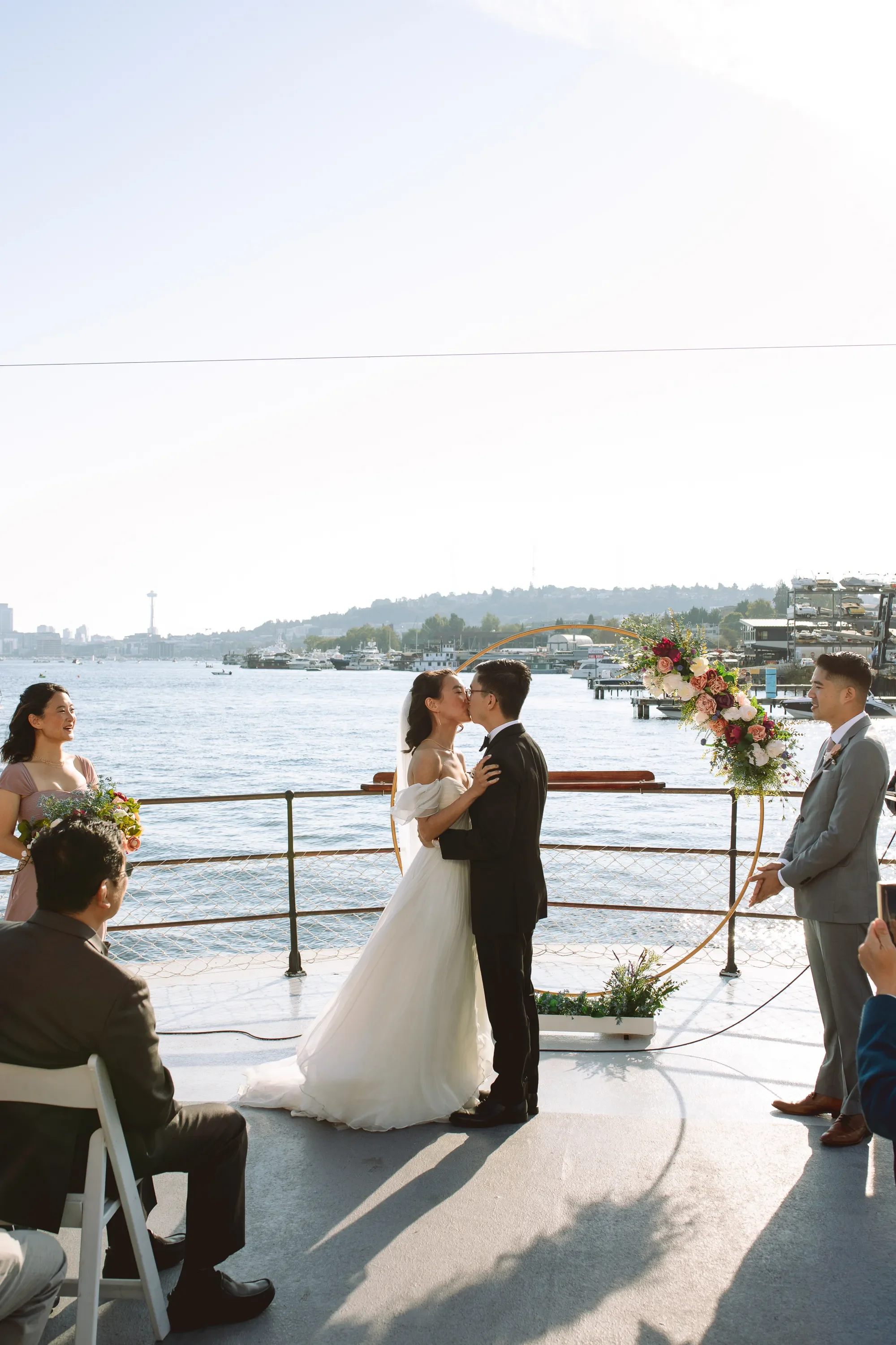 first-kiss-wedding-ceremony-at-mv-scansonia-wedding-venue-in-seattle.webp