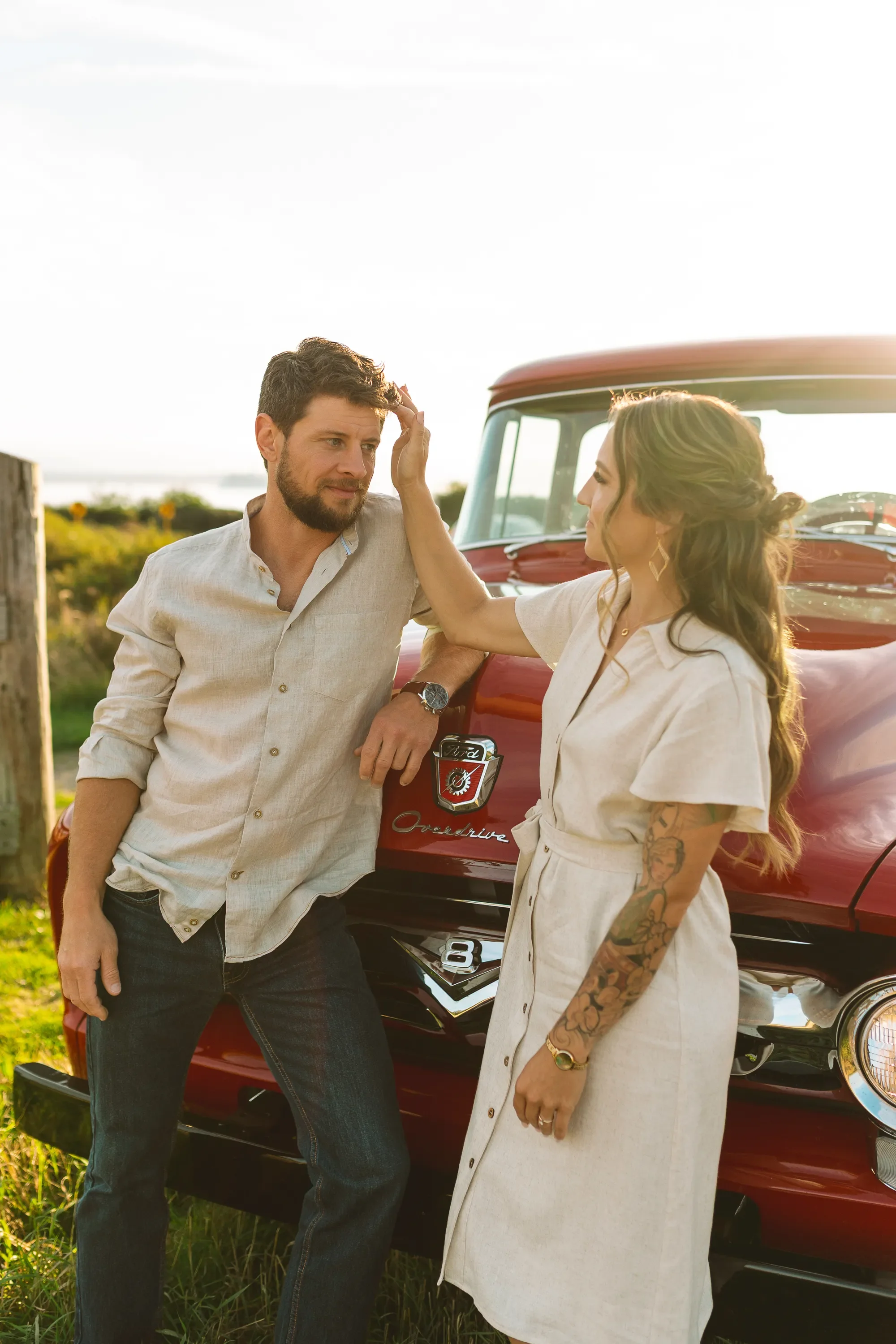 whidbey-island-engagement-photos-red-vintage-truck-ebeys-landing.webp
