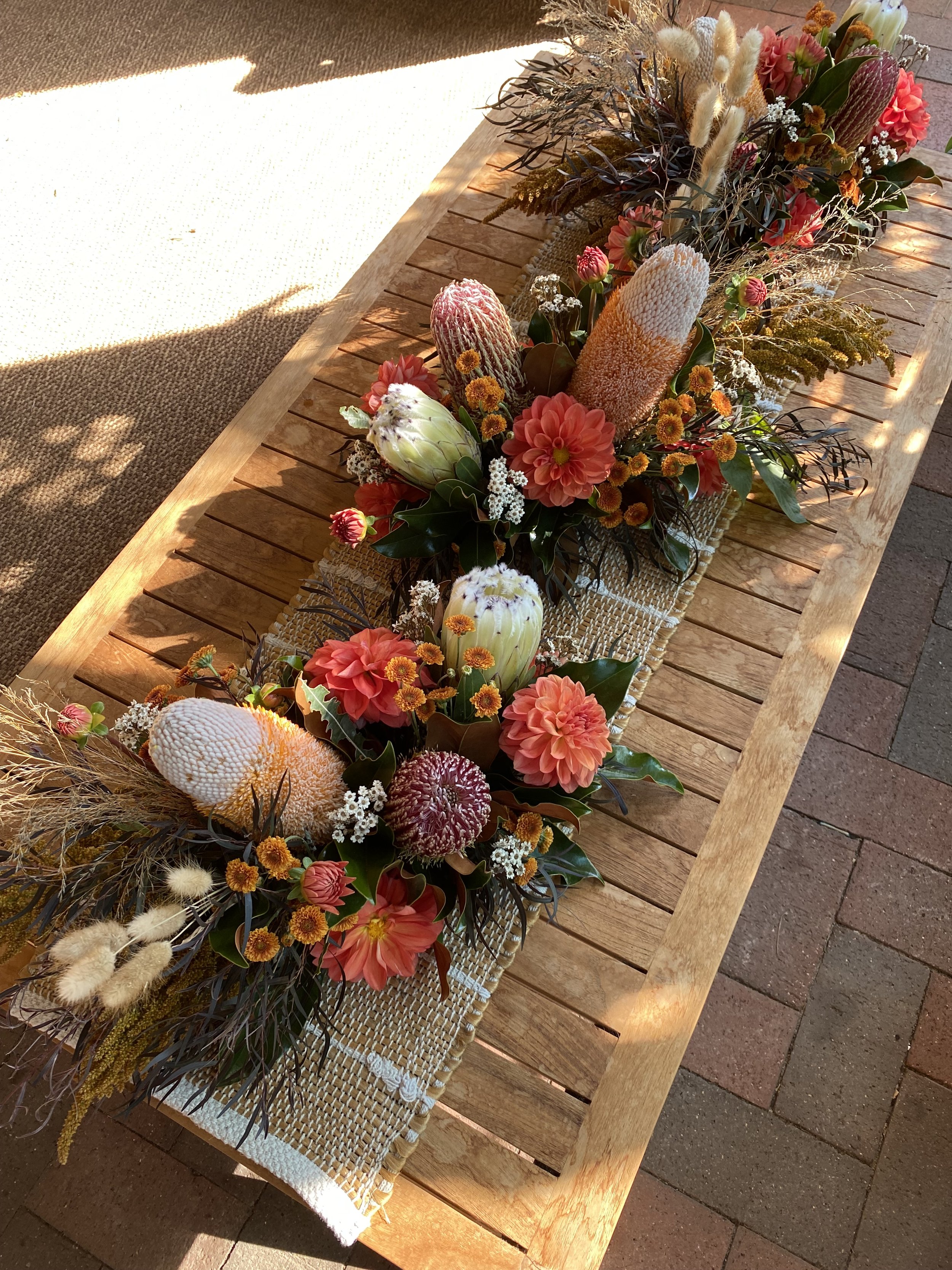 orange natives corporate table arrangements.jpg