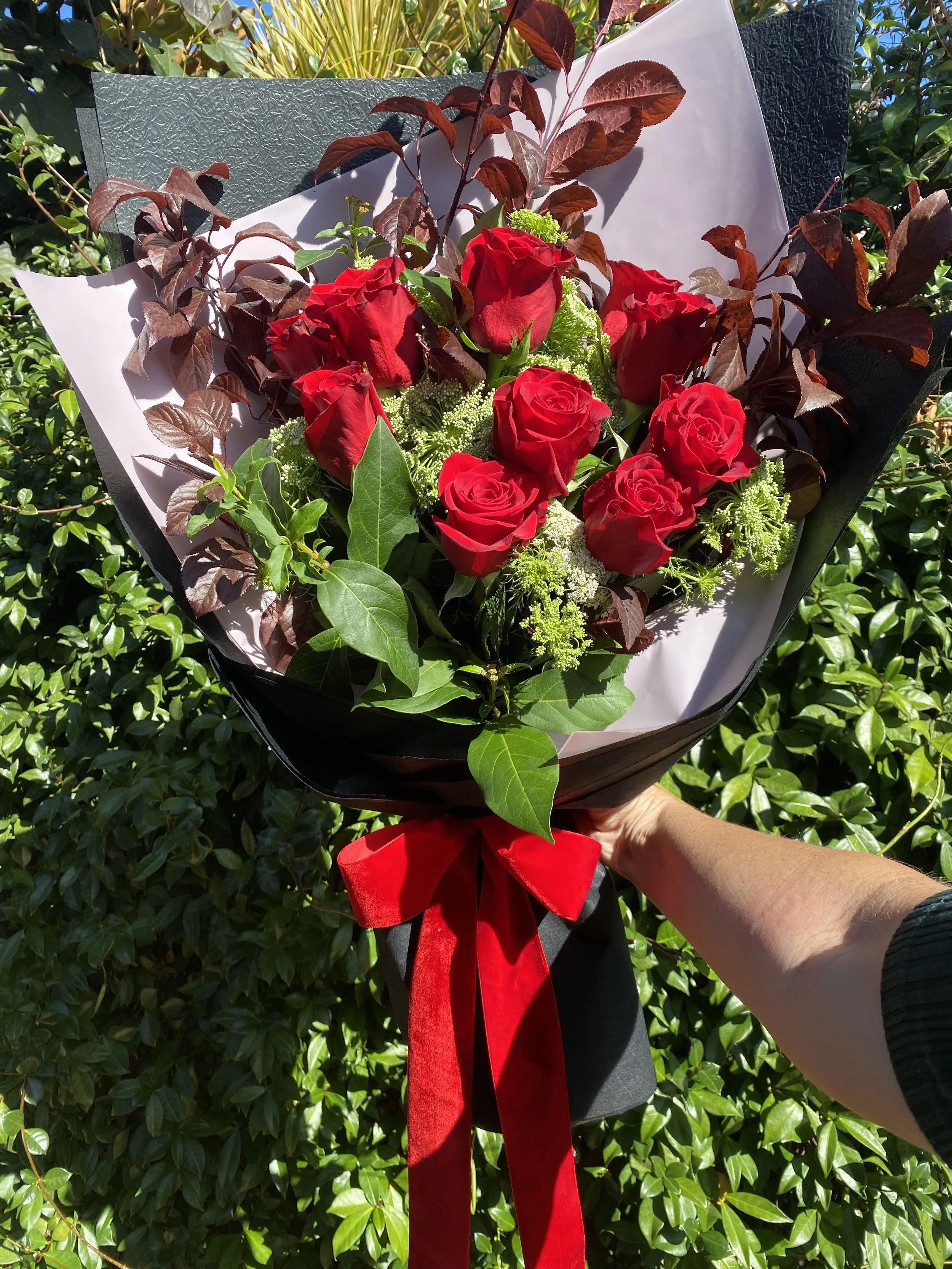 Red Rose bouquet Soviet style (11 Roses). Stunning red rose gift bouquet wrapped in premium black and pink papers with luxe red velvet bow. Designed and created by penny Dormer, Wild Heart Flowers. Perth event florist.