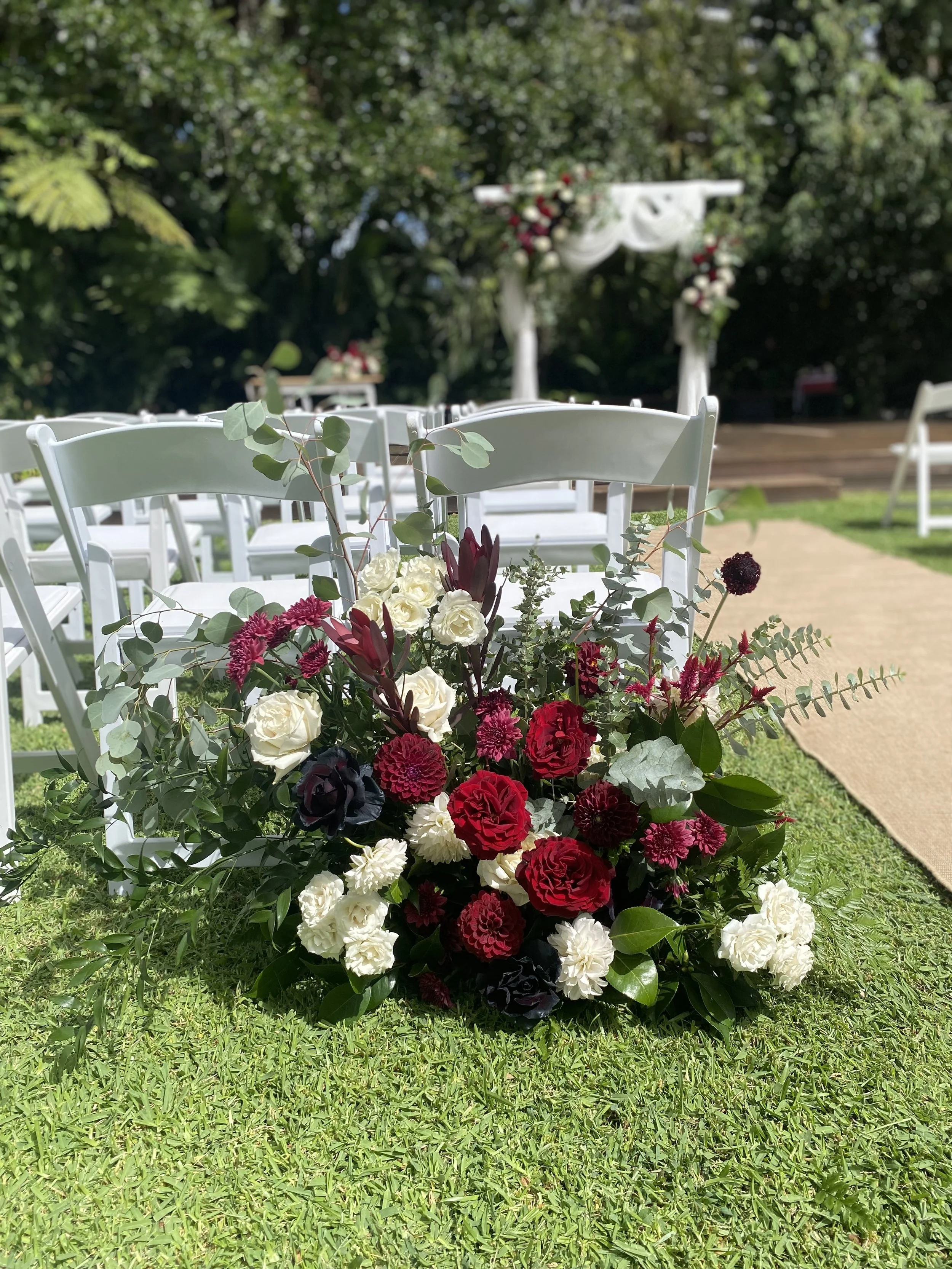 burgundy red white ceremony aisle entrance ground floral left.jpg