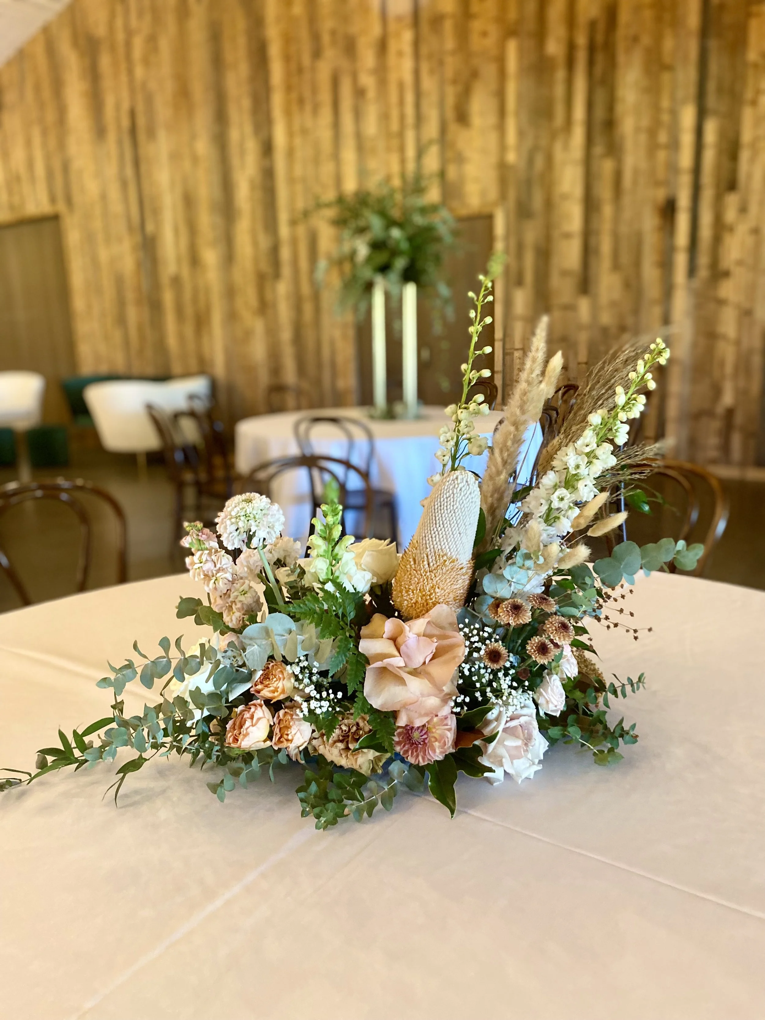 Soft autumn banksia x garden reception table arrangement.jpg