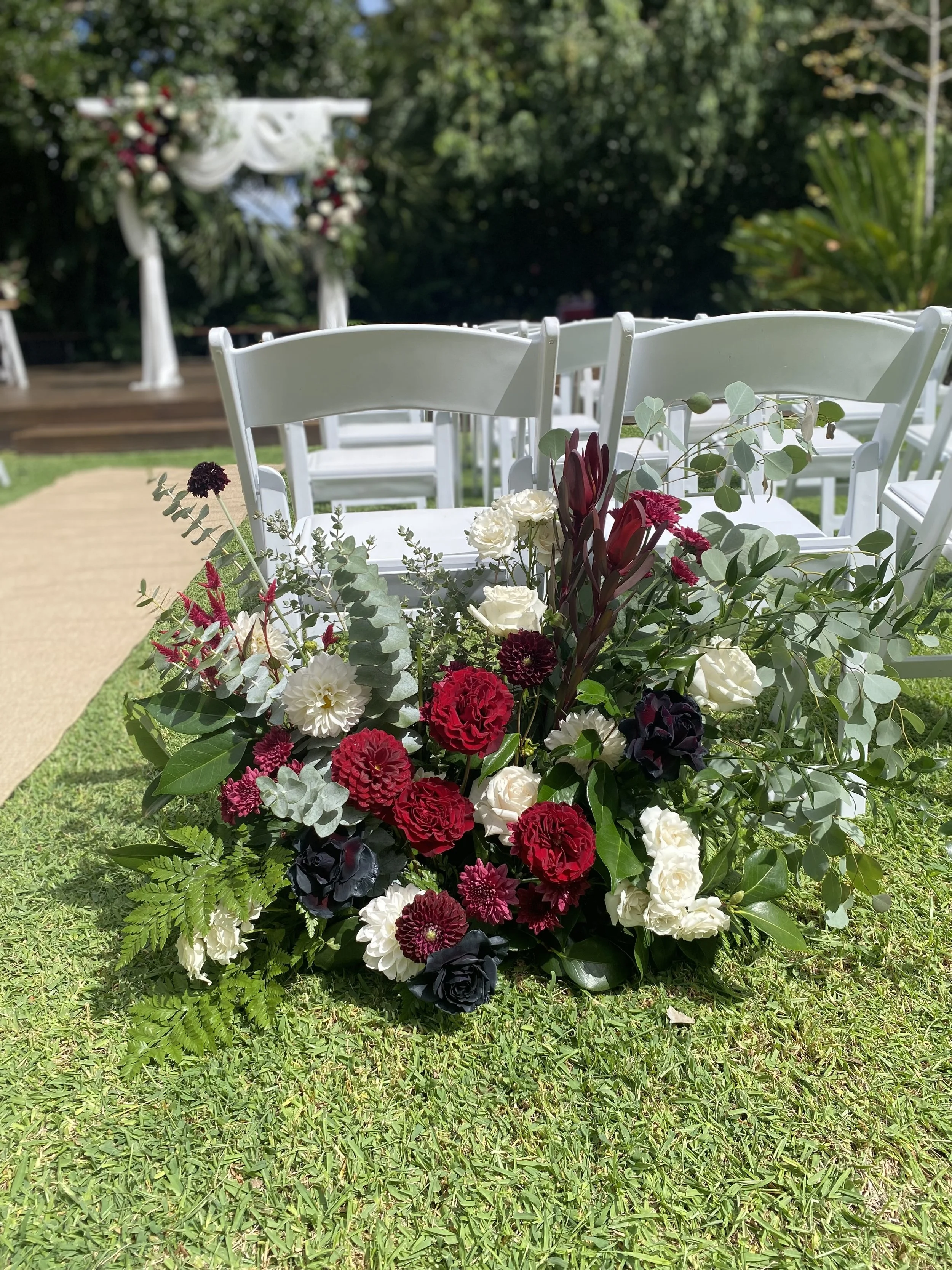 burgundy red white ceremony aisle entrance ground floral right.jpg