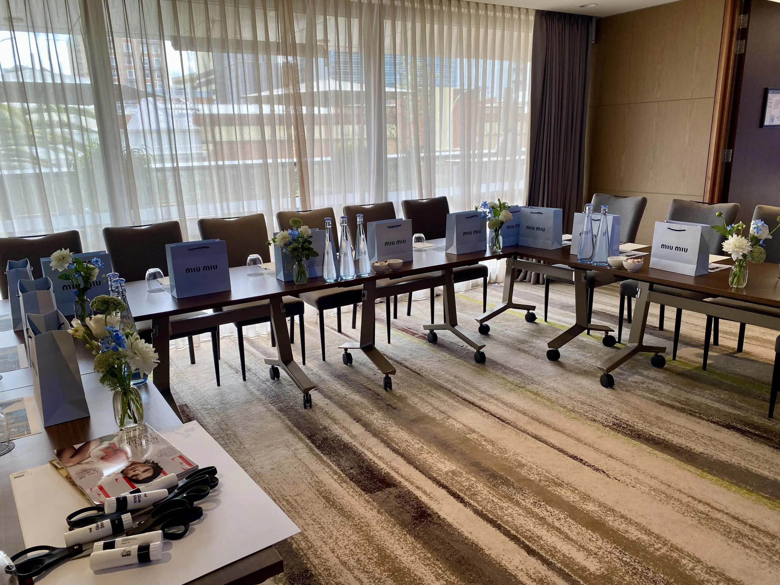 miu miu speaker event budvases on guest table.jpg