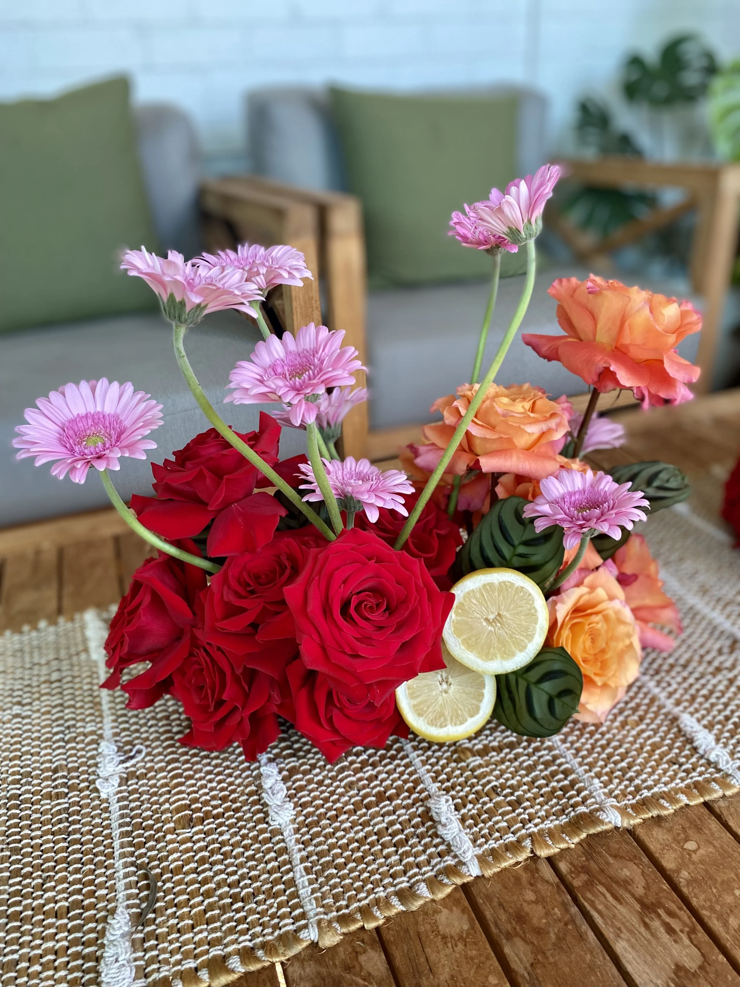 modern grouped pink red orange citus table arrangement.jpg