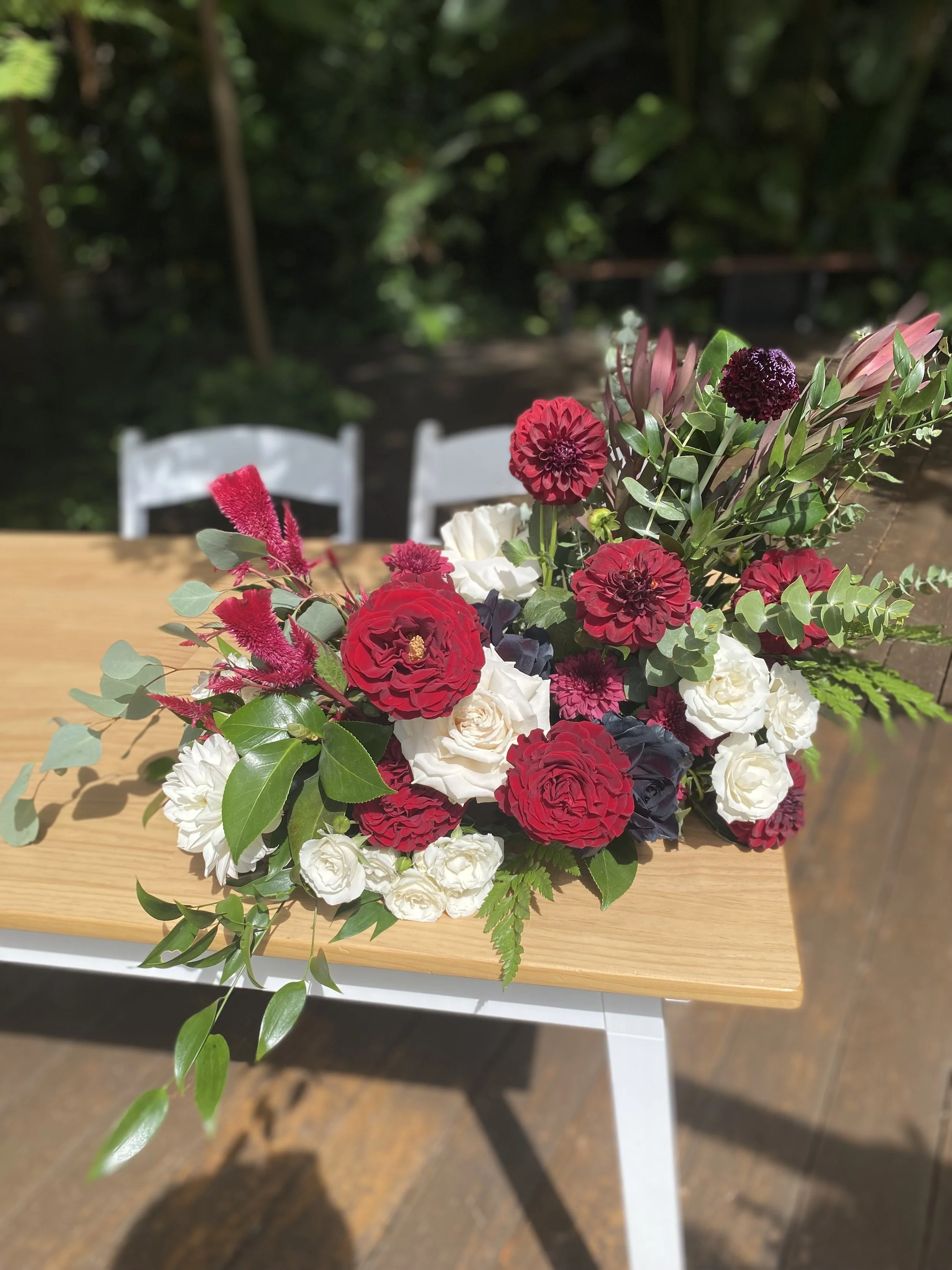burgundy red white signing table arrangement.jpg