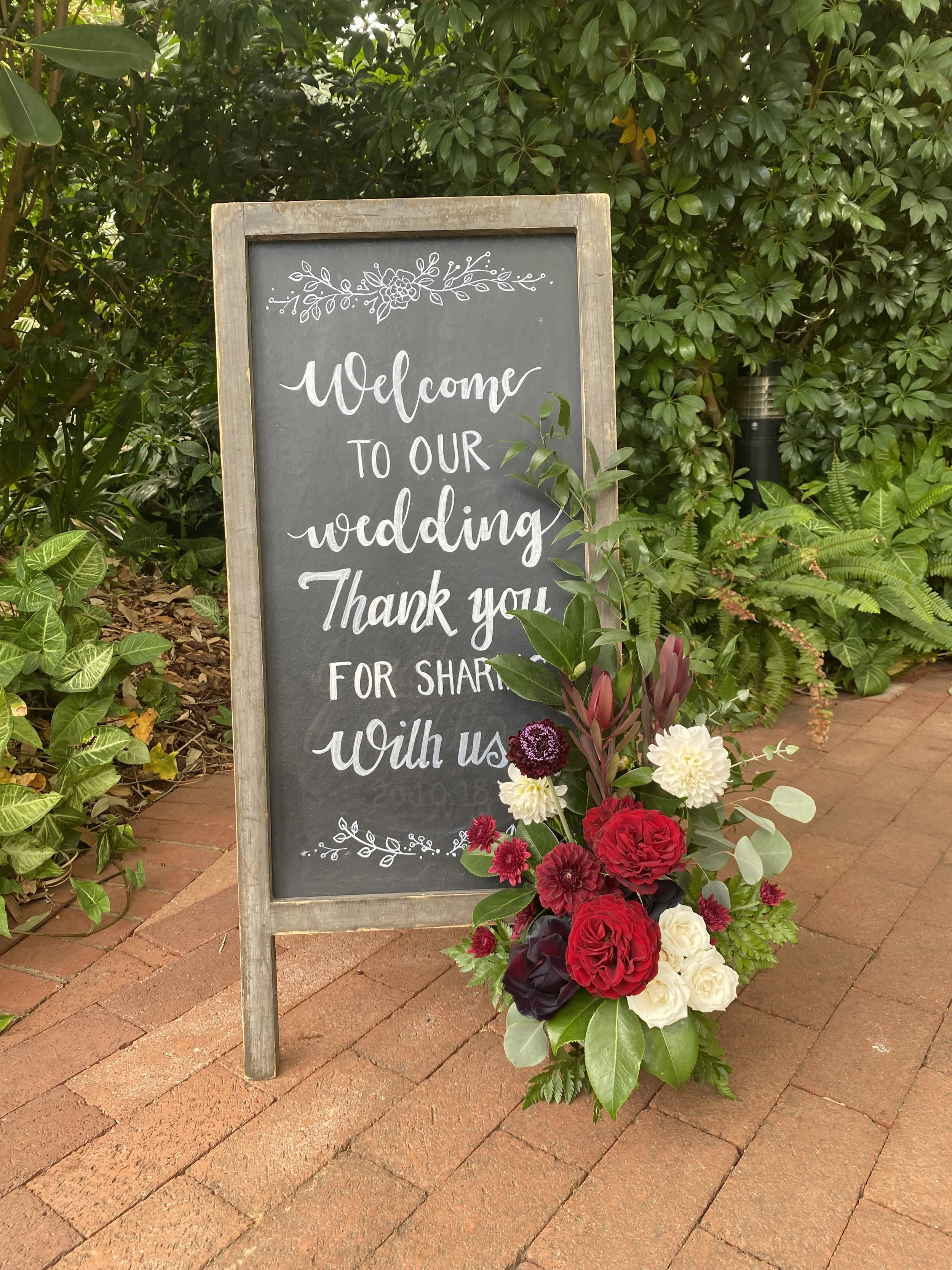burgundy red white welcome sign.jpg