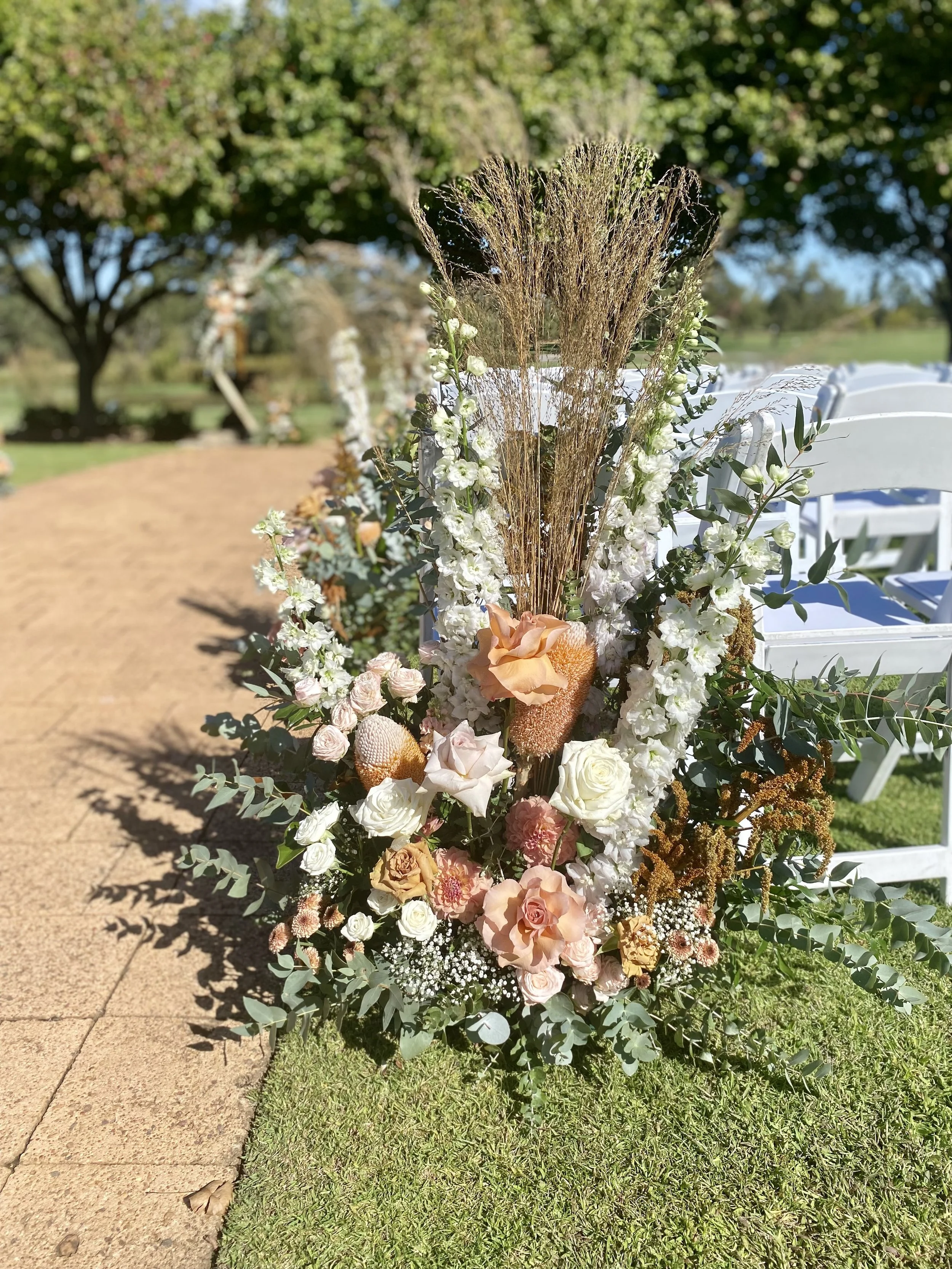 Aisle Entrance ground florals_blush pink, peach, brown, white.jpg
