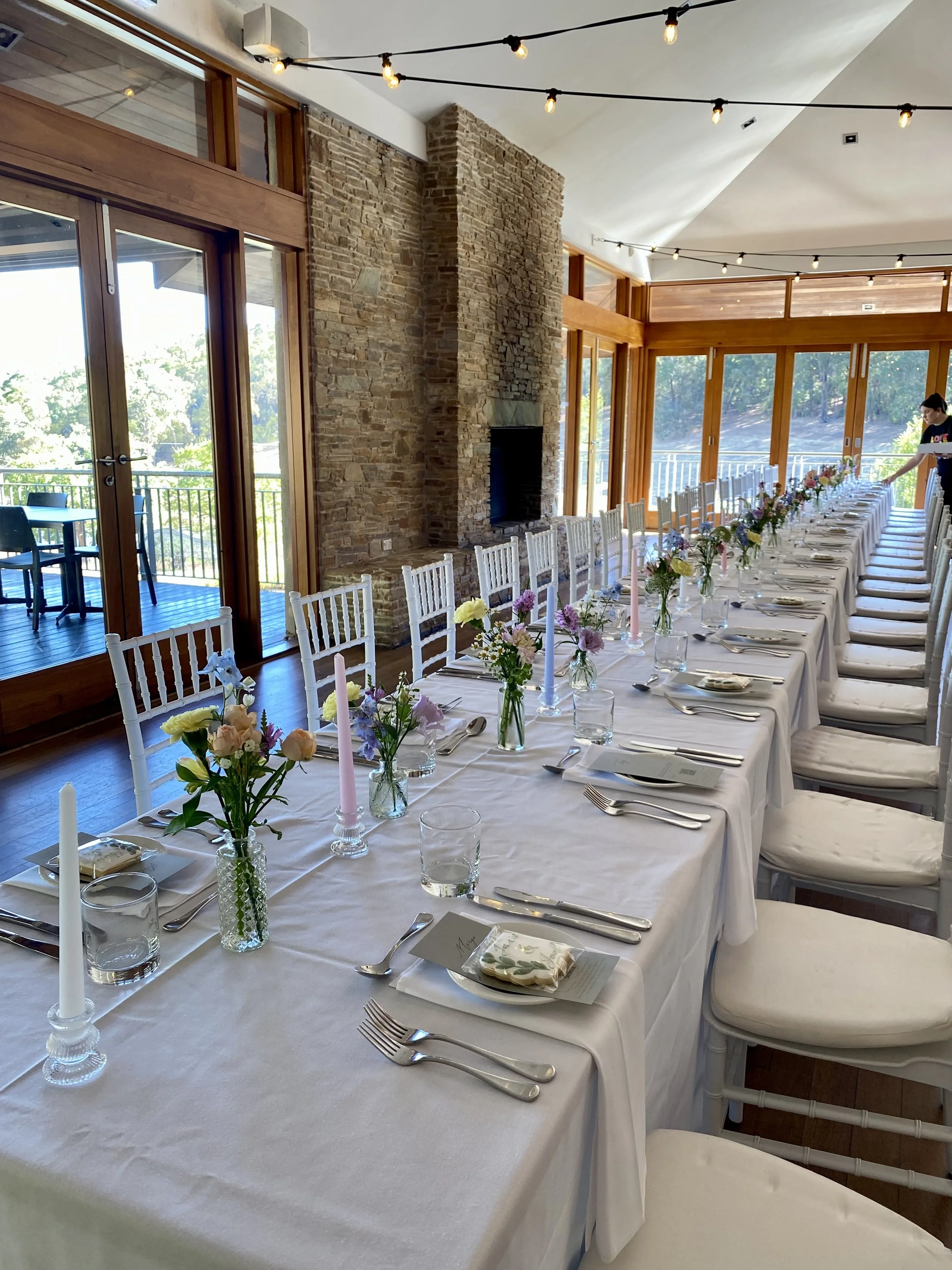 Millbrook Winery pastel flowers bud vases long table.jpg