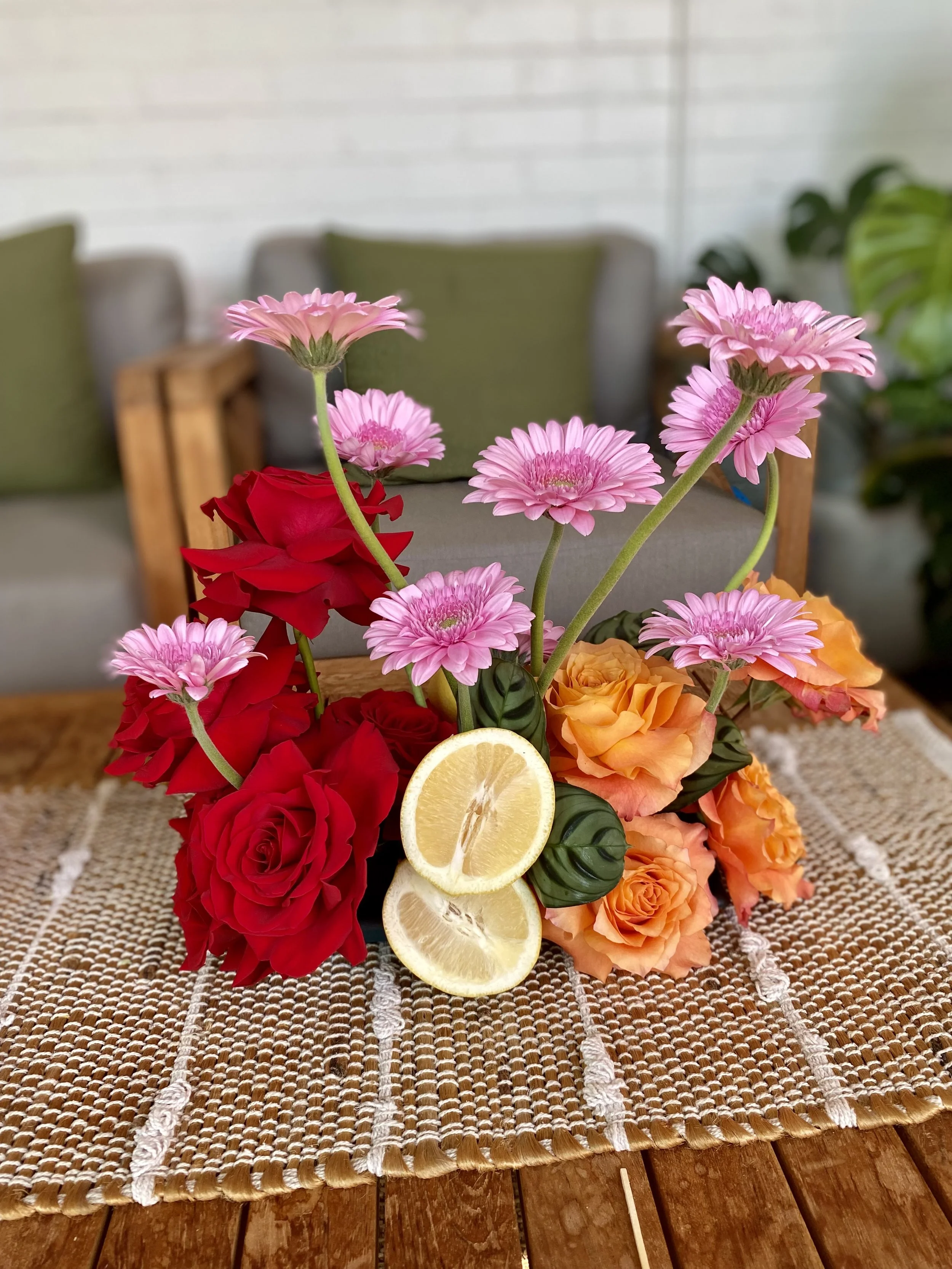 Modern vibrant pink red orange citrus arrangement.jpg