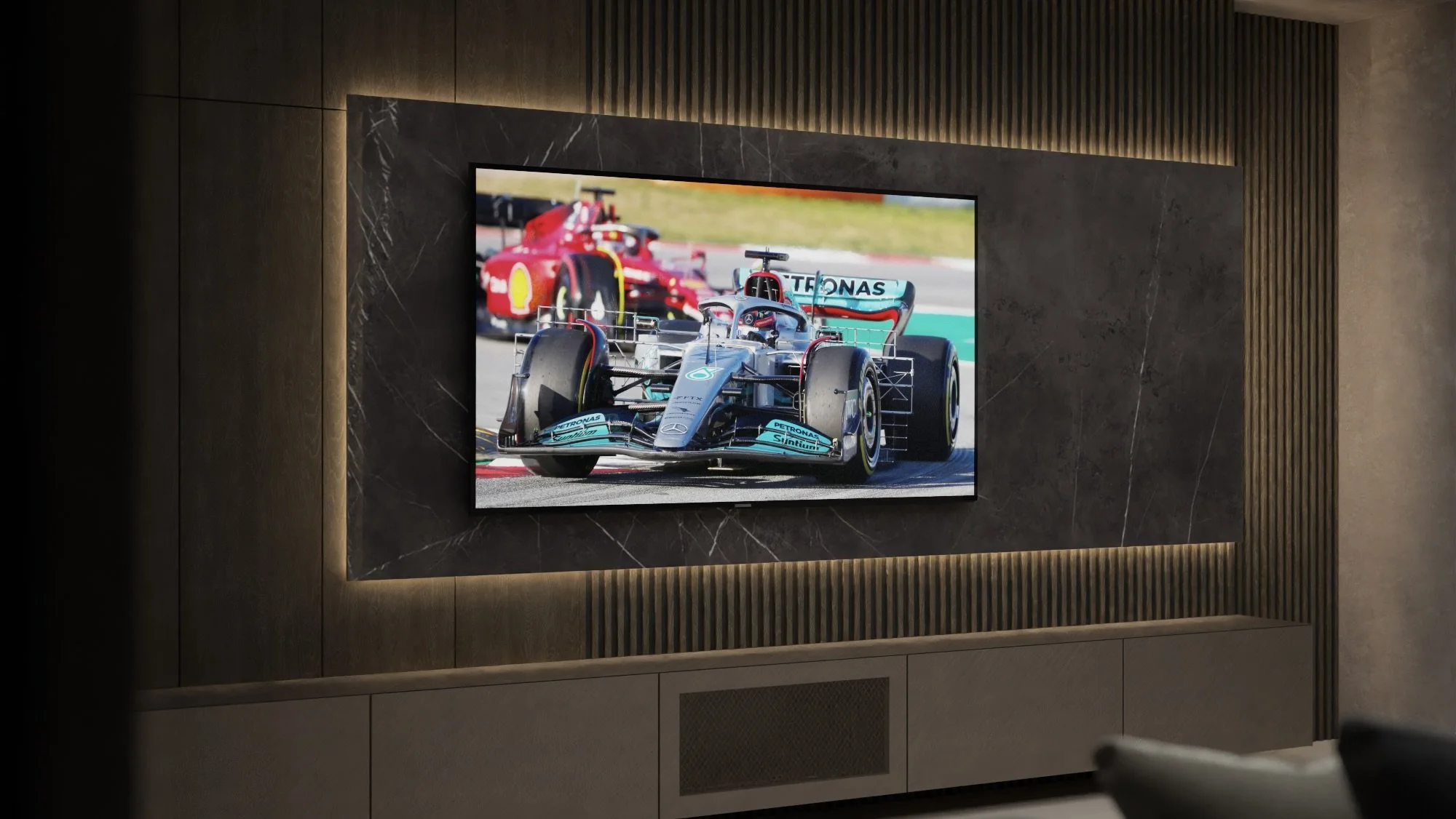 A flat-screen TV on a dark marble and wood-paneled wall displaying a Formula 1 race with cars on a track.