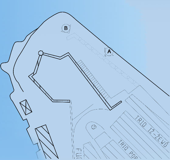 Blueprint of a building with labeled areas, stairs, and parking lots.