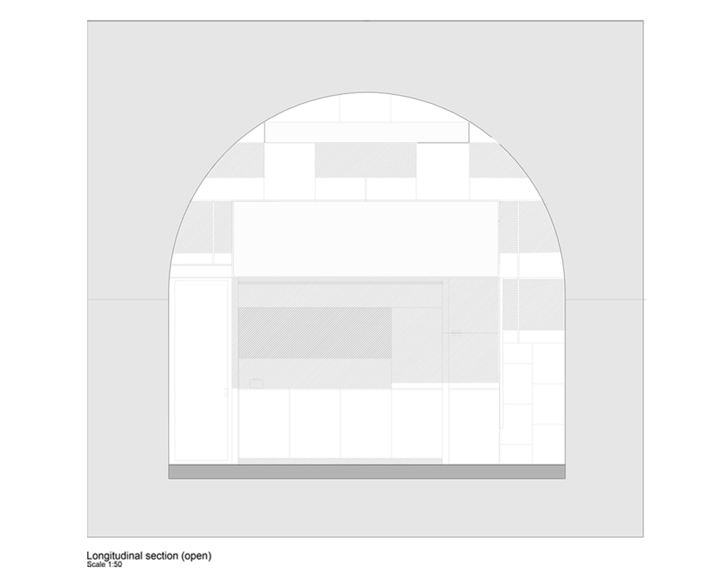 Architectural drawing of a longitudinal section of a building, showing interior space with furniture and interior details at scale 1:50.