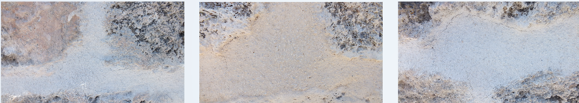Close-up of sandy and rocky terrain with different textures and colors.