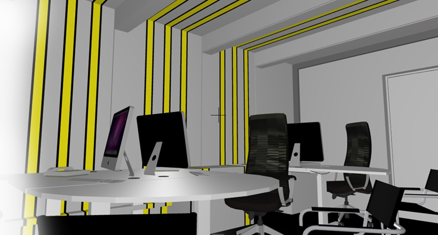 A modern office with computers and black ergonomic chairs, featuring a design with yellow and gray accents in the wall panels.