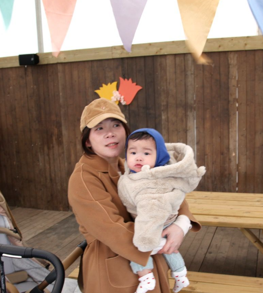 client mum holding her baby