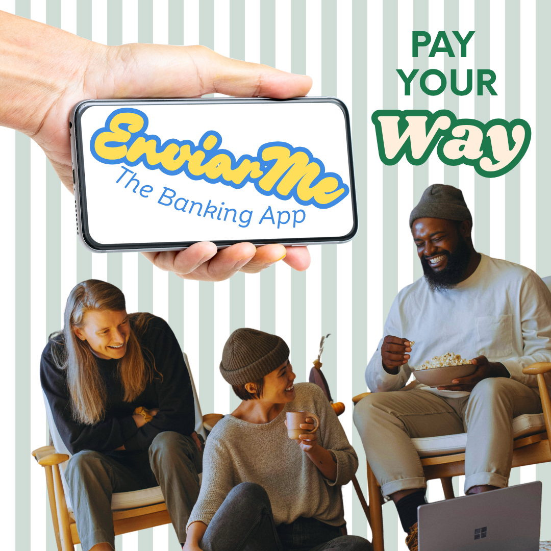 A person holding a smartphone displaying the logo of 'EmiaMe The Banking App' with the slogan 'Pay Your Way'. In the background, three people are sitting on chairs, smiling and enjoying a conversation with snacks and a laptop in a cozy setting.