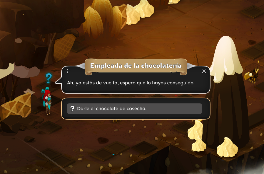 Escena de un videojuego con personajes en un entorno de chocolate, donde una empleada de la chocolatería habla con la jugadora. Hay montones de dulces y chocolate en el fondo.