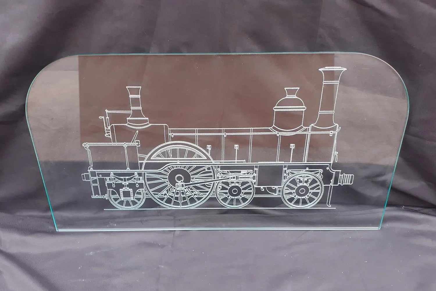 Etched glass pane with steam locomotive