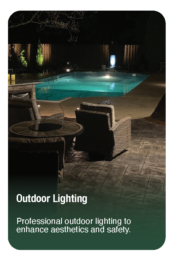 Nighttime backyard scene featuring a lit swimming pool surrounded by patio furniture and outdoor lighting for safety and aesthetics.