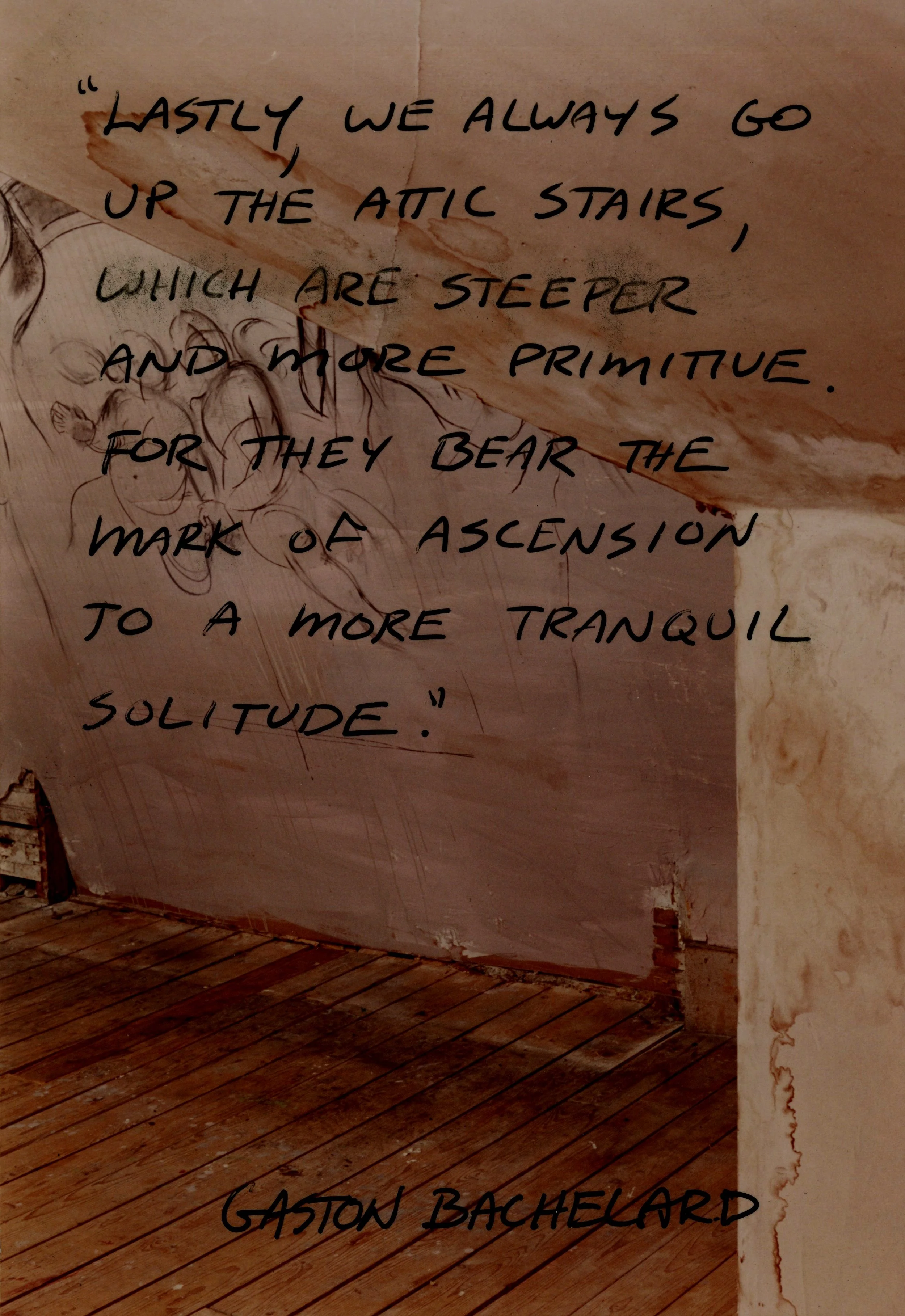 A rustic attic space with wooden floors, featuring a quote by Gaston Bachelard about attic stairs written on the wall. The wall shows signs of wear and an unfinished drawing.