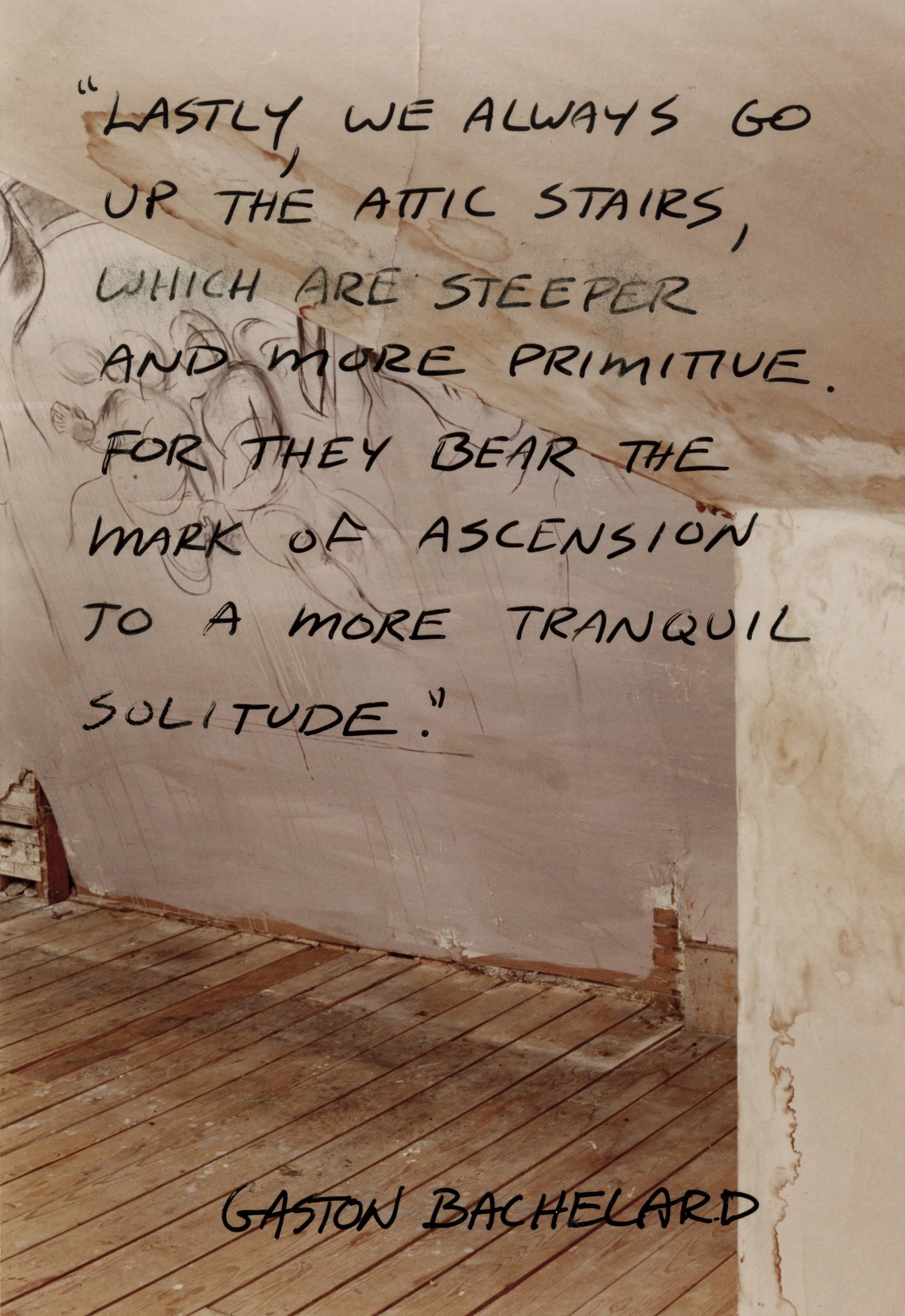 Quote on wall with text: "Lastly, we always go up the attic stairs, which are steeper and more primitive. For they bear the mark of ascension to a more tranquil solitude." - Gaston Bachelard. Background features rustic wooden floor and unfinished wall.
