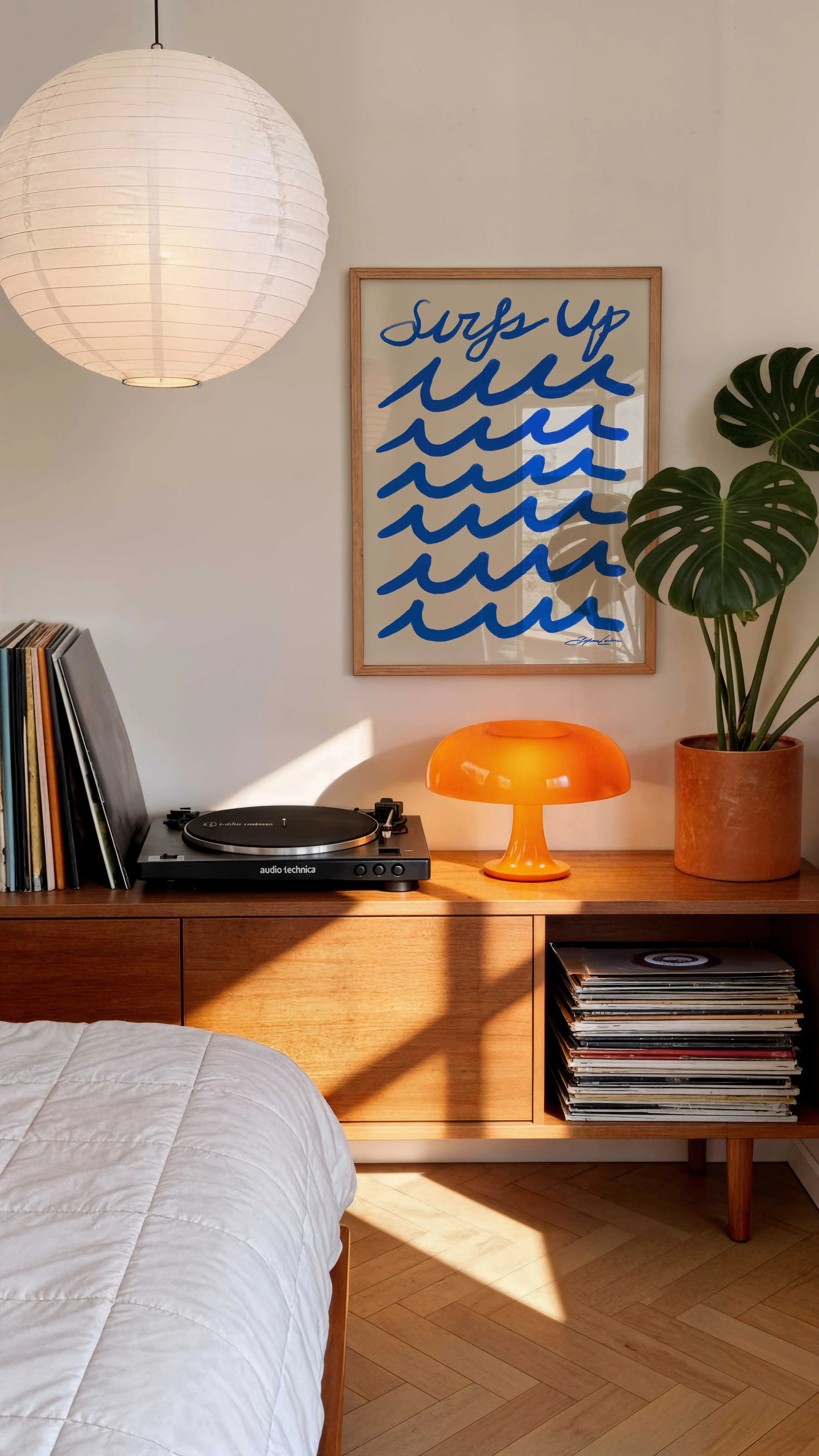 Surfs-Up-beacher-surf-poster-Framed-Poster-in-a-Modern-Trendy-Bedroom-with-Orange-Lamp-and-Vinyls.jpg