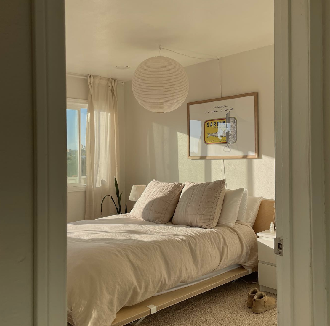 Sardines horizontal art print by Stephie Cardona for KunstbyStephie styled above the bed in a sunny minimalistic bedroom