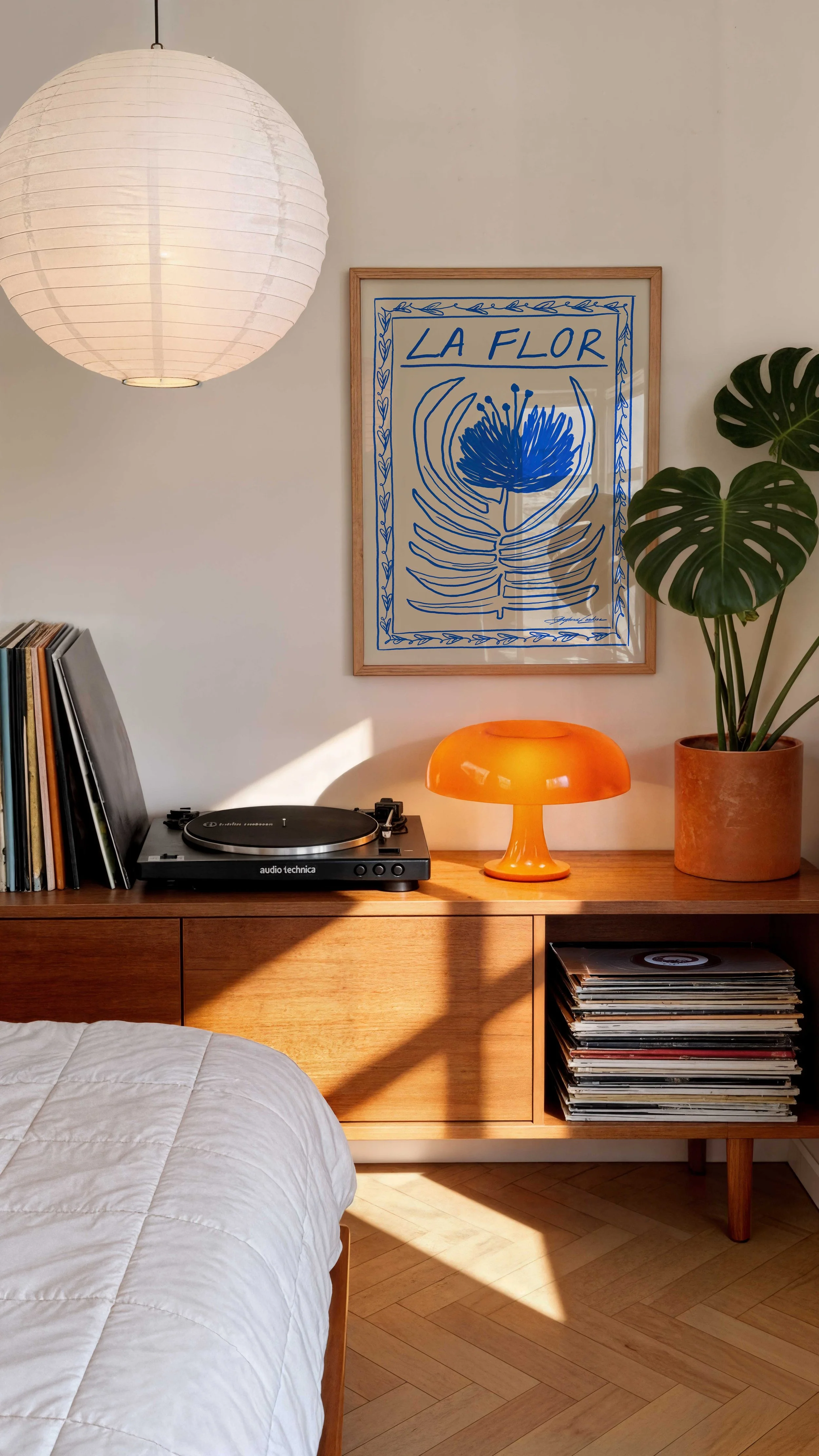 La-Flor-Blue-Flower-Mexican-Folk-Art--Framed-Poster-in-a-Modern-Trendy-Bedroom-with-Orange-Lamp-and-Vinyls.jpg