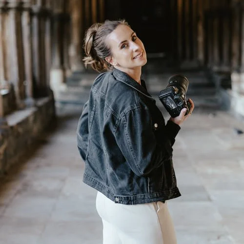 female wedding photographer in denim jacket