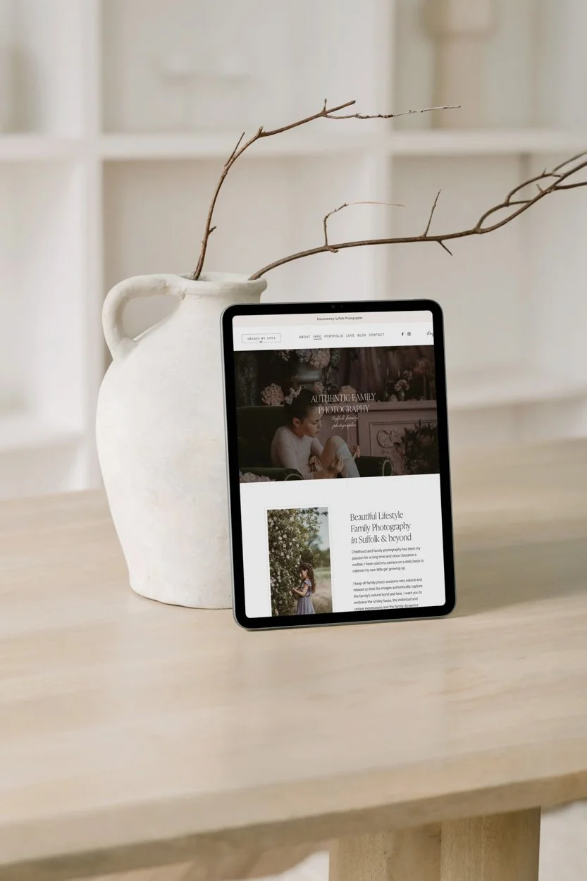 squarespace photography website on an ipad in front of a vase with twigs