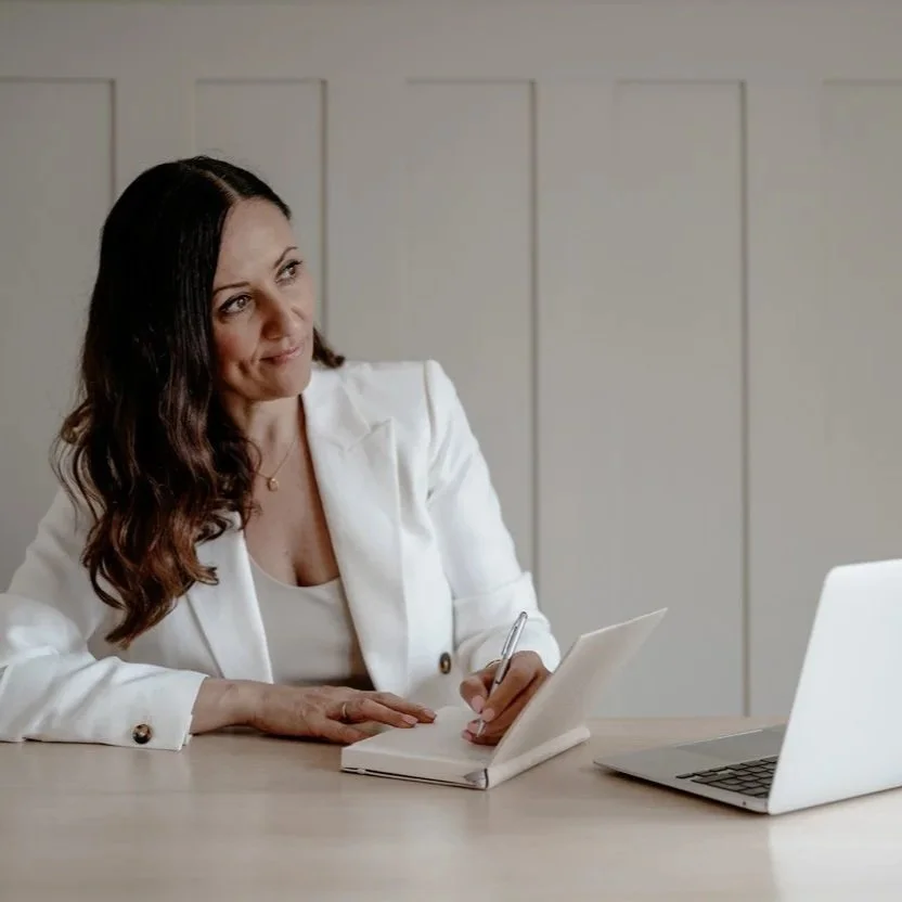 squarespace designer clare butler based in the UK sitting at her desk