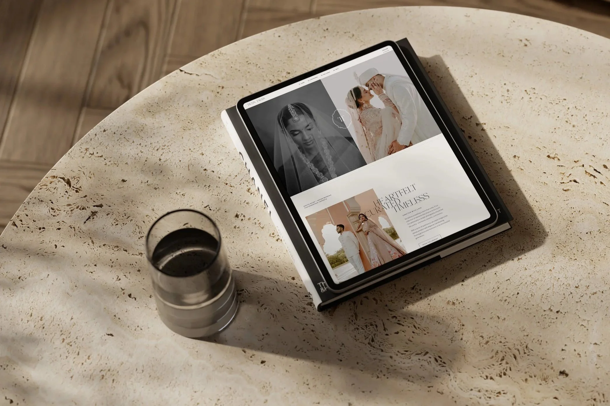 ipad mock up on marble table displaying squarespace website for a wedding photographer
