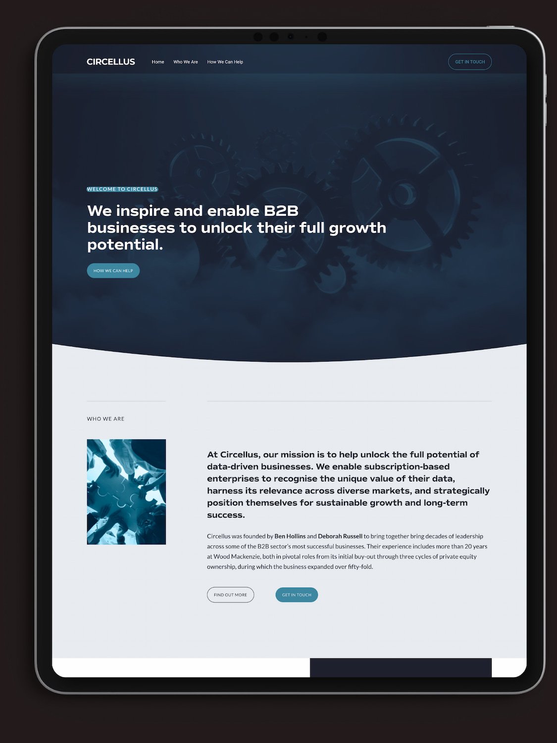 ipad mock up showing a website for a business consultancy with navy palette and images of cogs