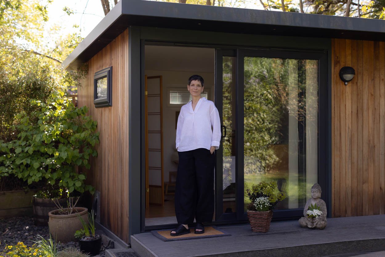 acupuncturist client of squarespace designer uk clare butler standing outside her acupuncture studio