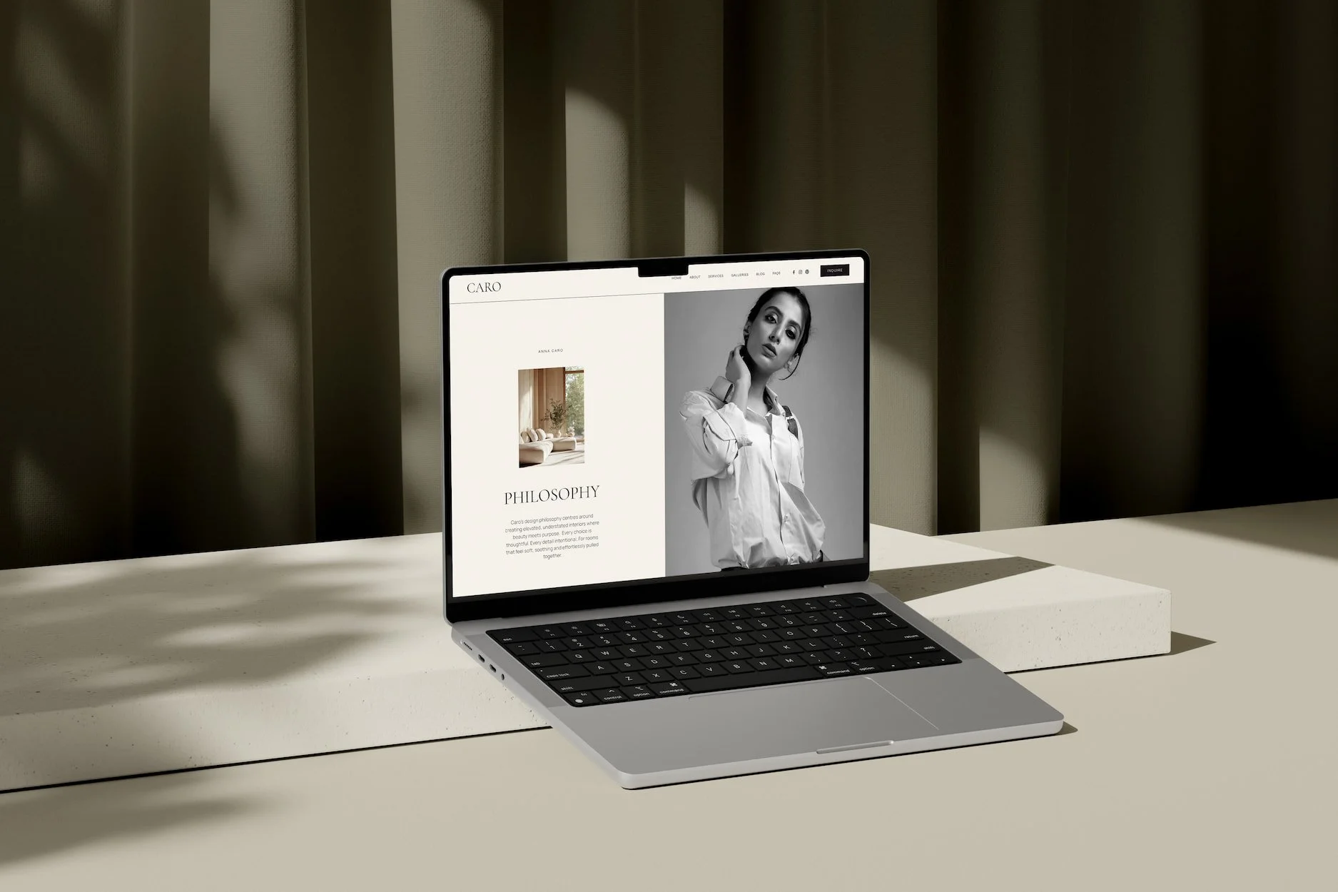 Laptop mockup of a Squarespace website philosophy page for an interior designer