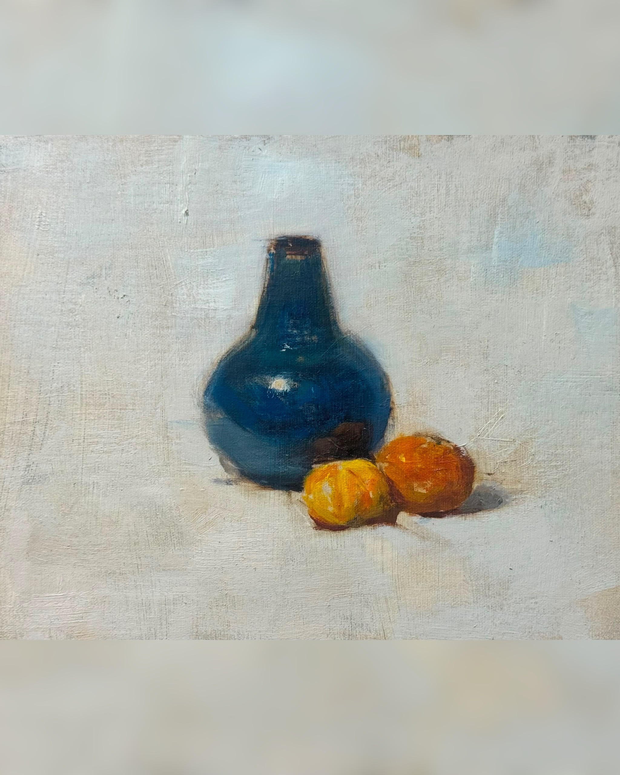 Blue bottle and tangerines