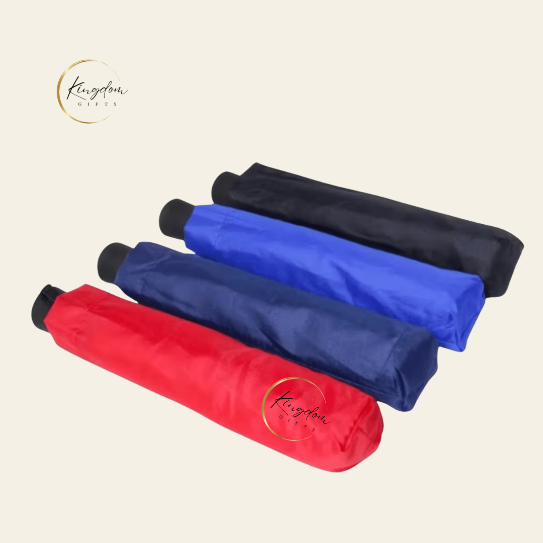 Assorted compact foldable umbrellas in red, blue, navy, and black sleeves — ideal for custom bulk orders and practical corporate gifts.
