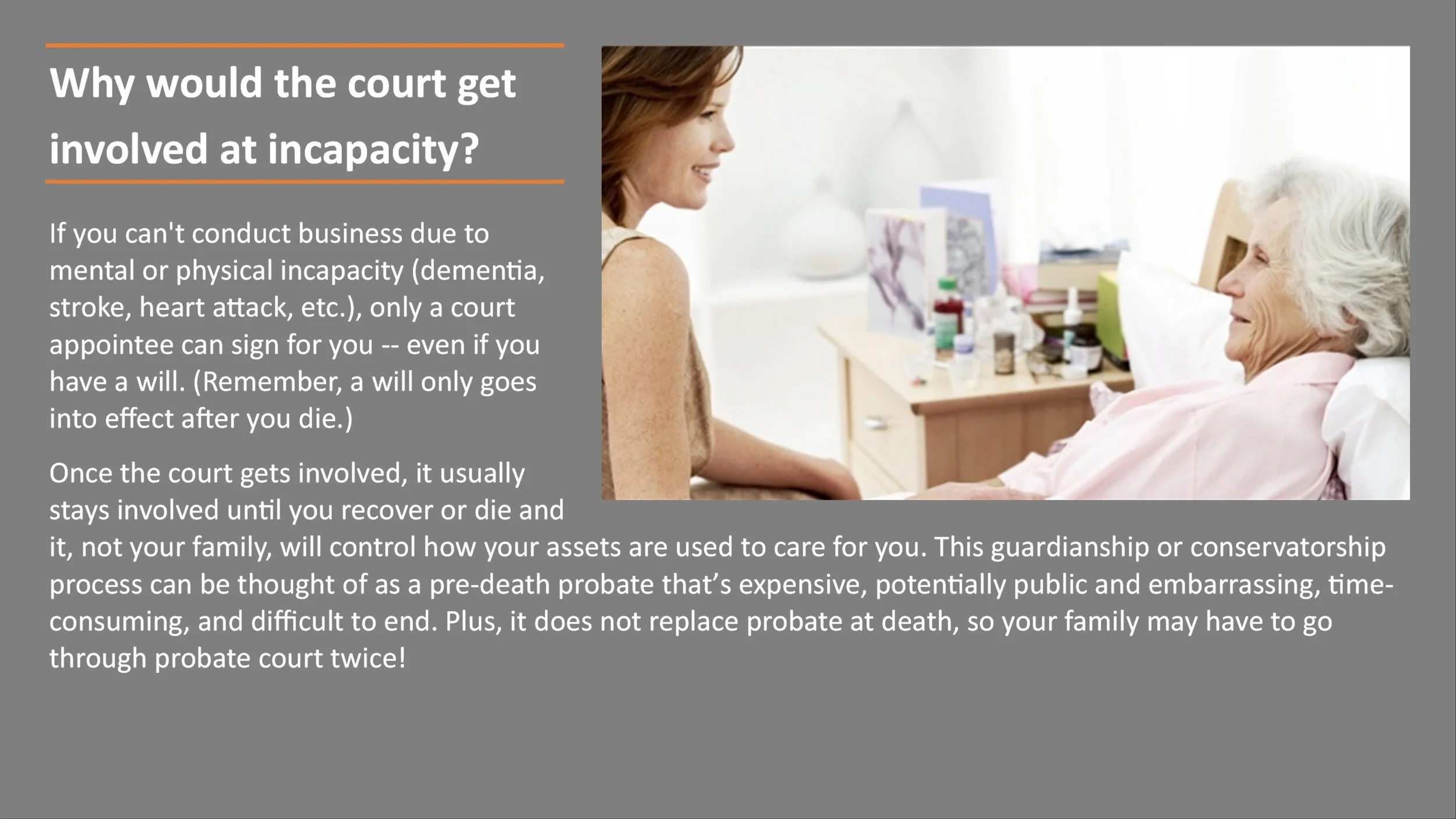 A woman with shoulder-length brown hair smiling and talking to an elderly woman with white hair lying in a hospital bed, with medical supplies on a bedside table.