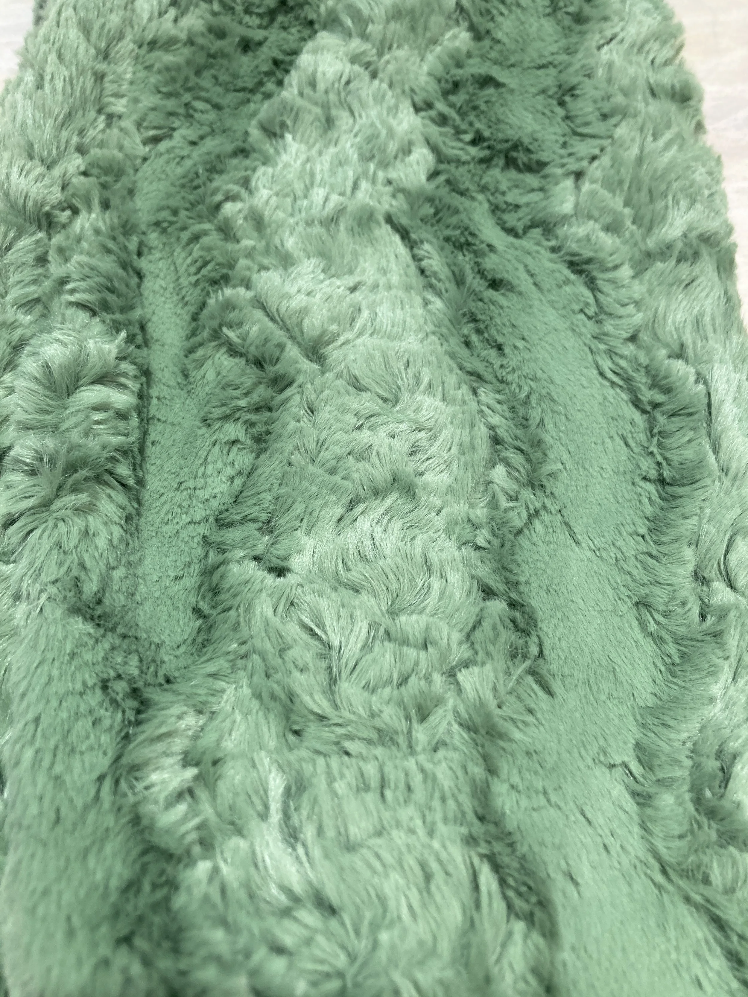 Handmade baby blanket featuring sage green Shannon Fabrics minky.