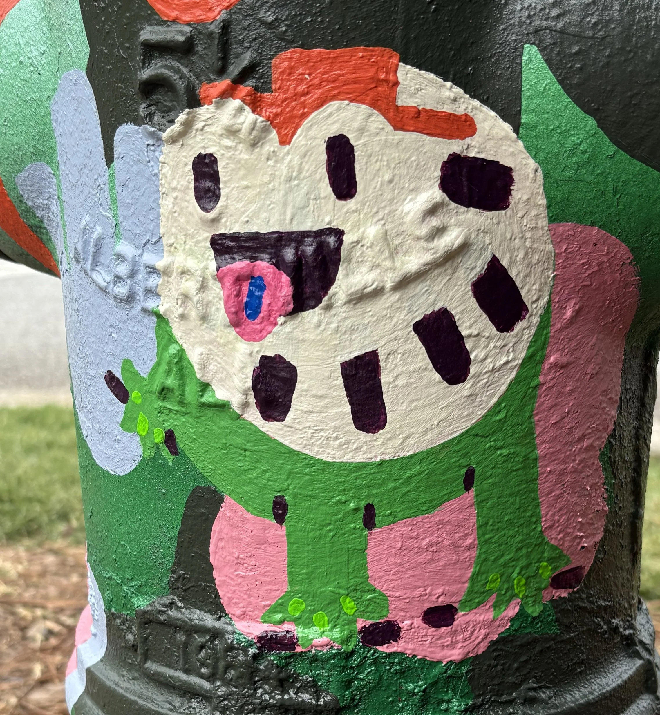 Colorful painted illustration of a cartoon dinosaur with a wide open mouth, green body, pink underside, and red spines on its back, with a blue tongue and purple spots.