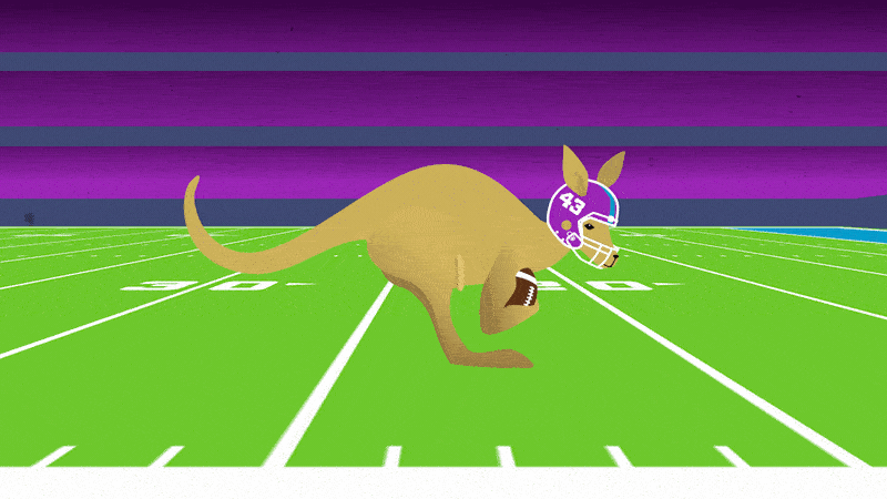 A cartoon kangaroo wearing a purple football helmet with the number 83, running on a green football field with purple and black stadium seats in the background, holding a football.