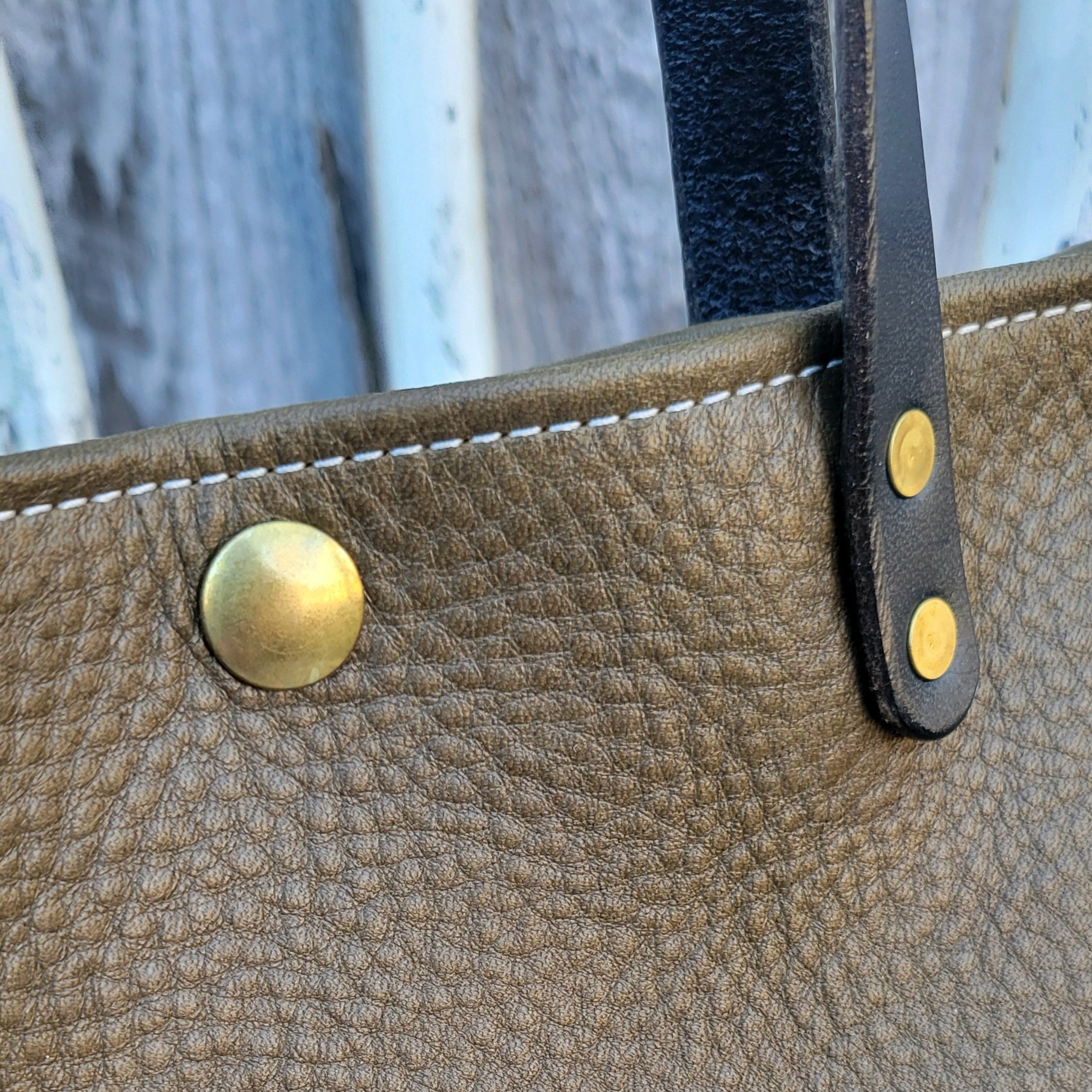 Leather mini tote bag featuring solid brass hadware
