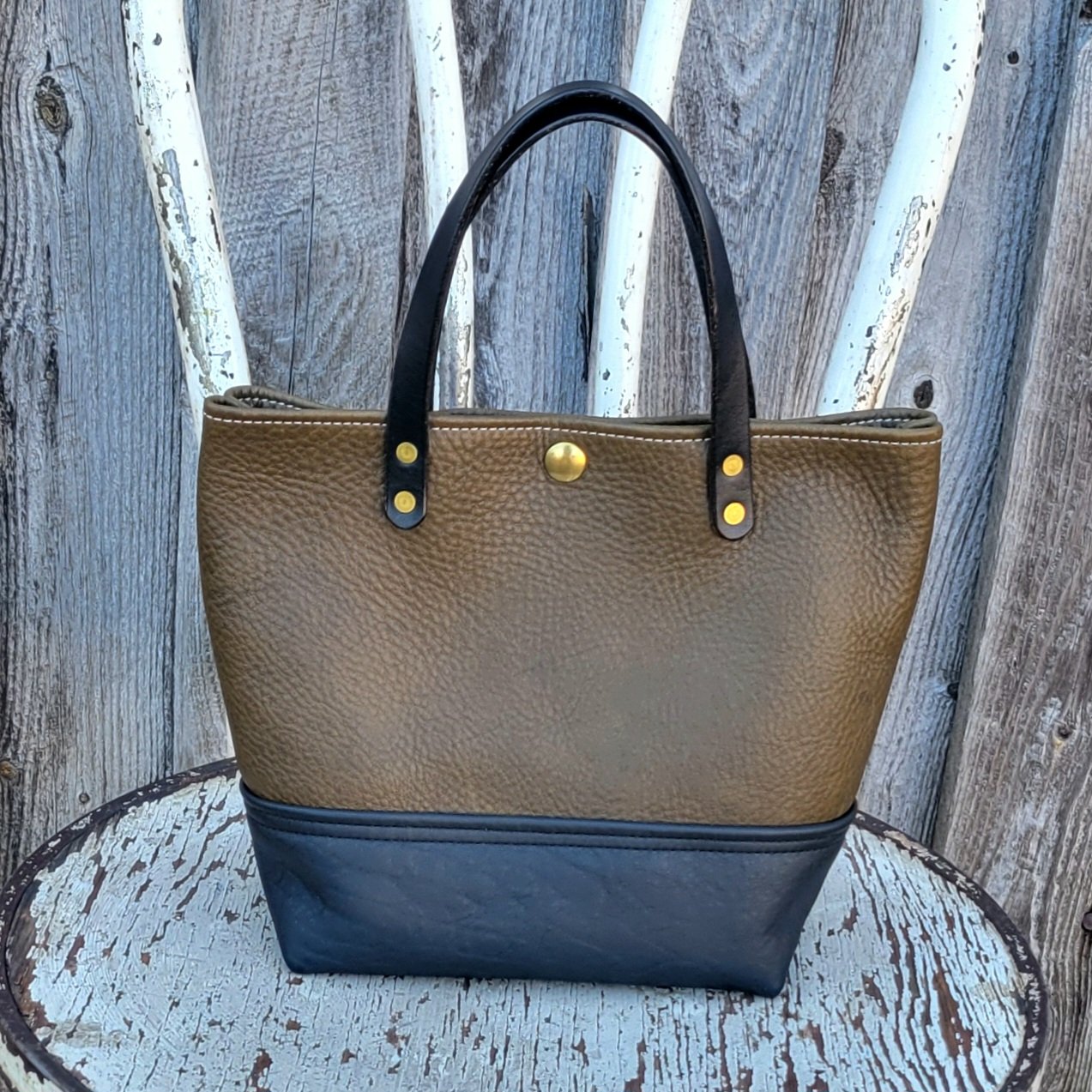 Leather mini tote bag in olive and black