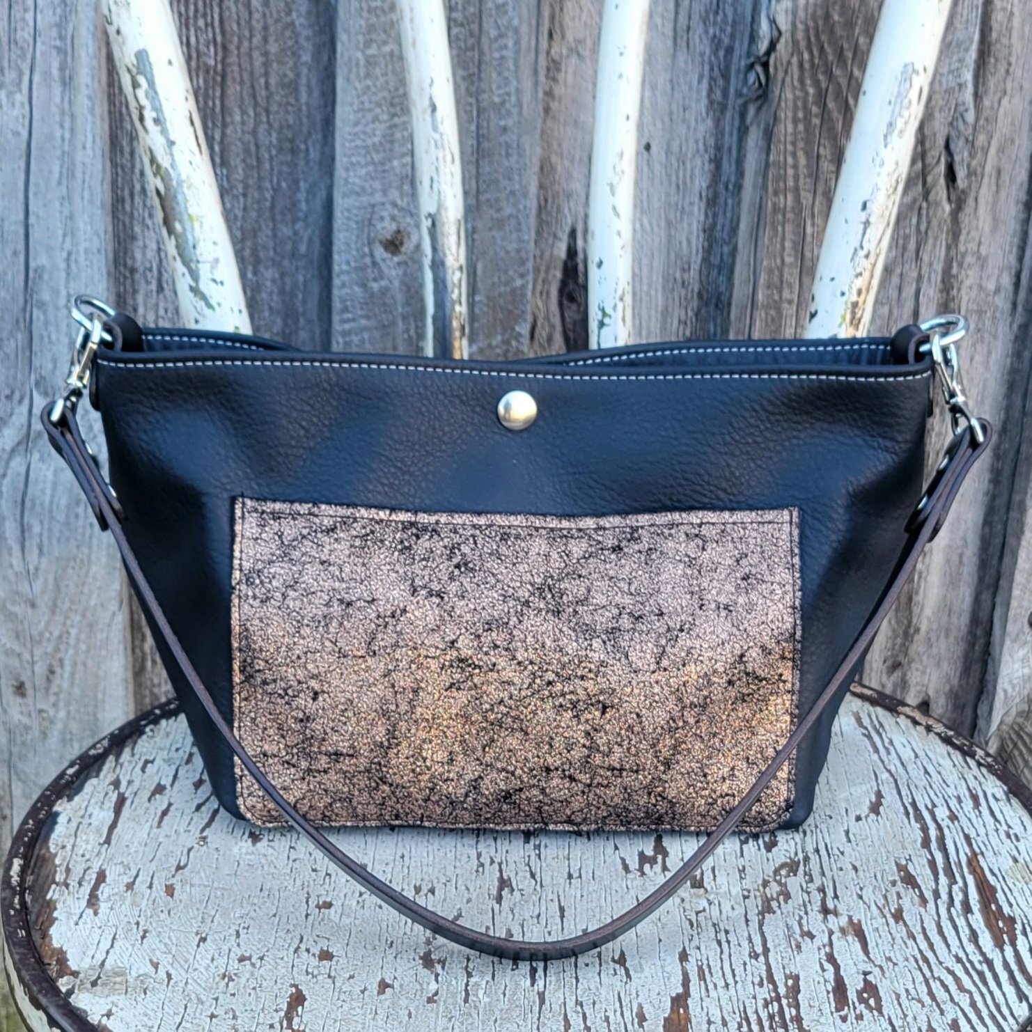Leather mini bucket bag in black and copper