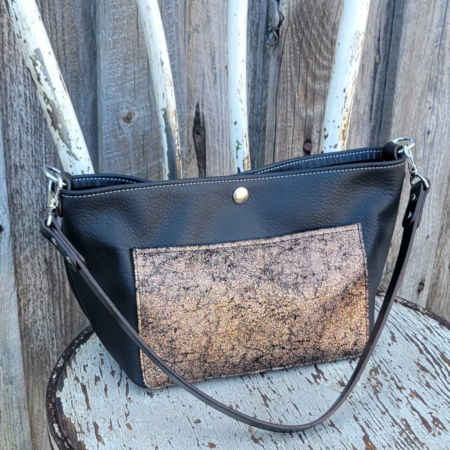 Mini leather bucket bag with bridle leather strap
