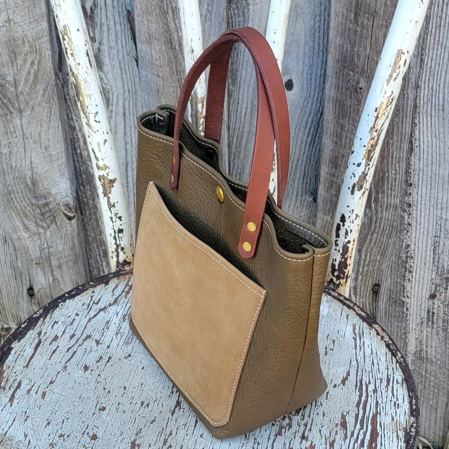 Earthy leather colors make for a casual style carry in this mini tote
